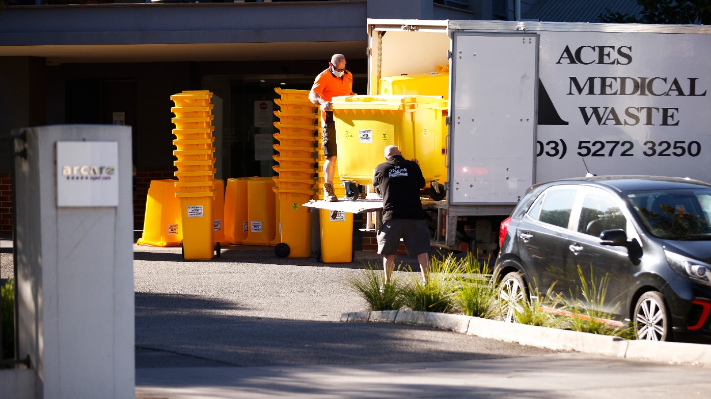 Medical waste bins are delivered to Arcare aged care facility in Maidstone, where a worker has tested positive to COVID-19.