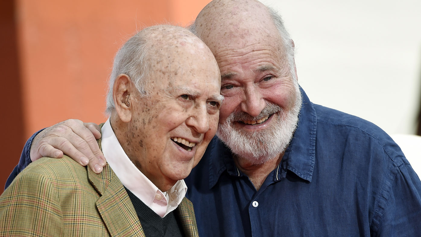 In this April 7, 2017 file photo, Carl Reiner, left, and his son Rob Reiner pose together following their hand and footprint ceremony at the TCL Chinese Theatre in Los Angele