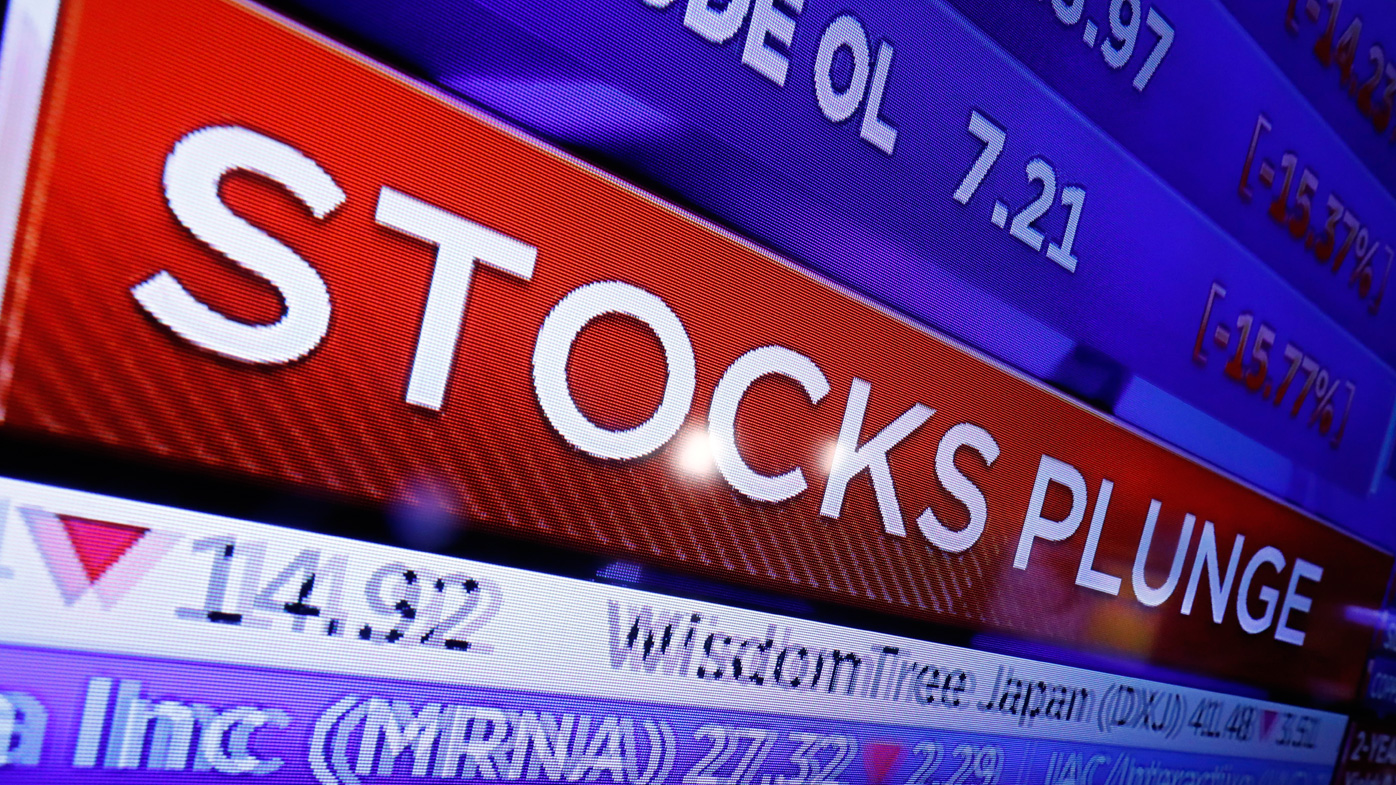 A television screen on the floor of the New York Stock Exchange headlines market activity