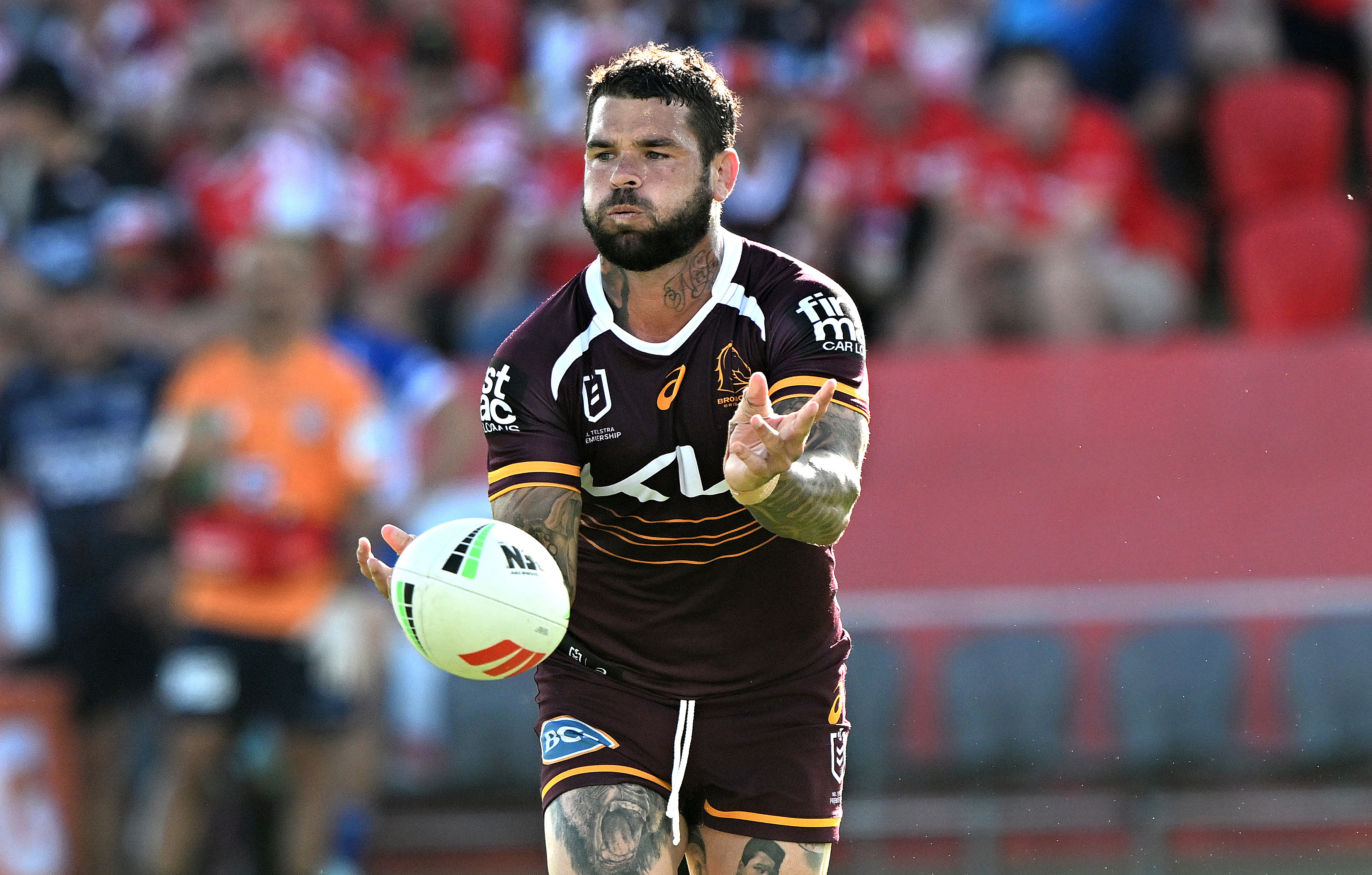 Adam Reynolds passes the ball during the 2025 NRL Pre-Season Challenge match between the Brisbane Broncos and the Canterbury Bulldogs.