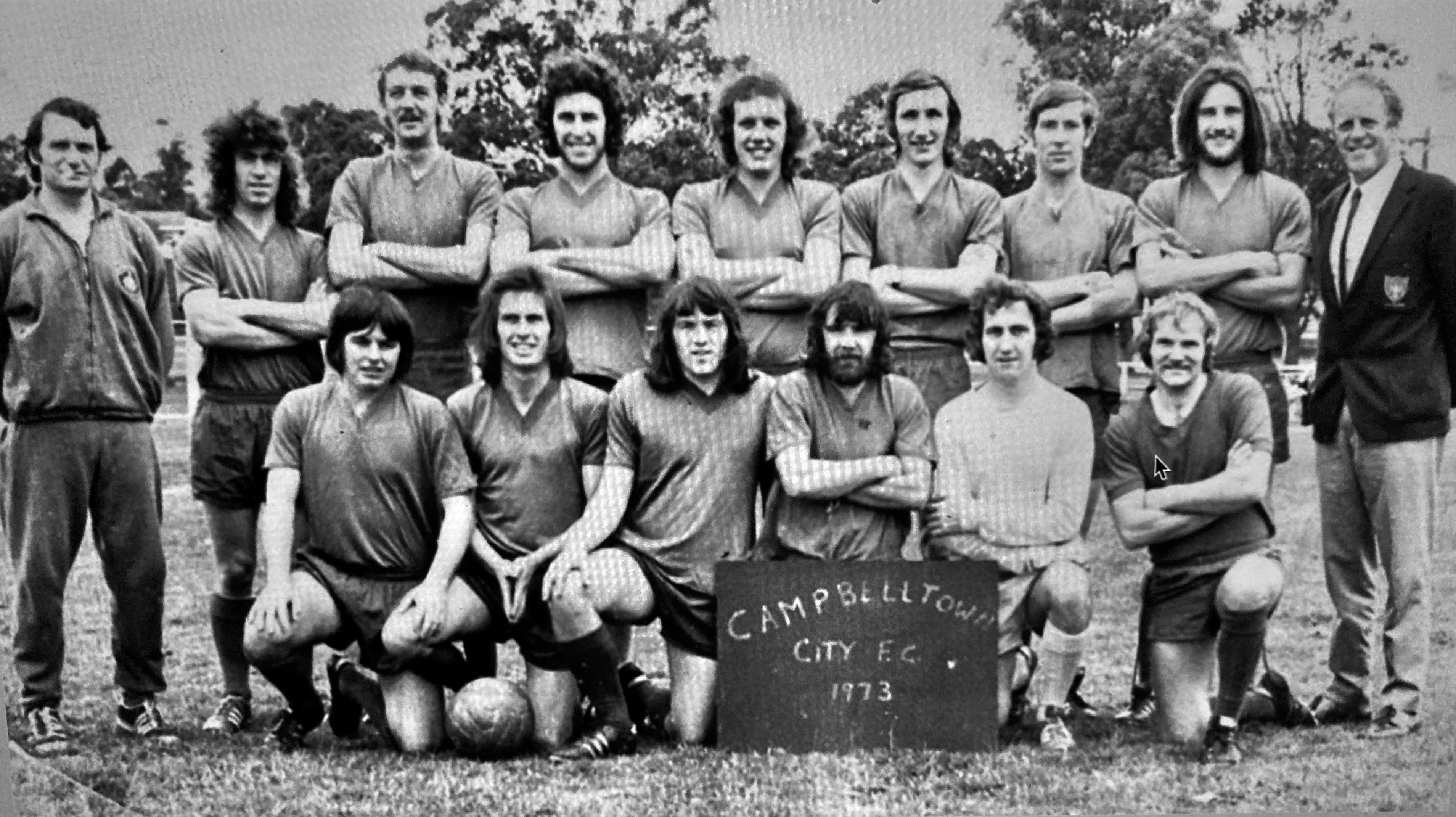 Manchester City fan John Cretney (front row, second from right) with his junior football club.