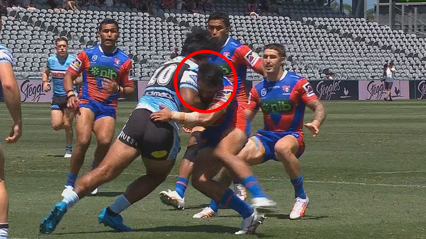 Newcastle's Krystian Mapapalangi was knocked out by this blow off the kick off in the trial match against the Sharks.
