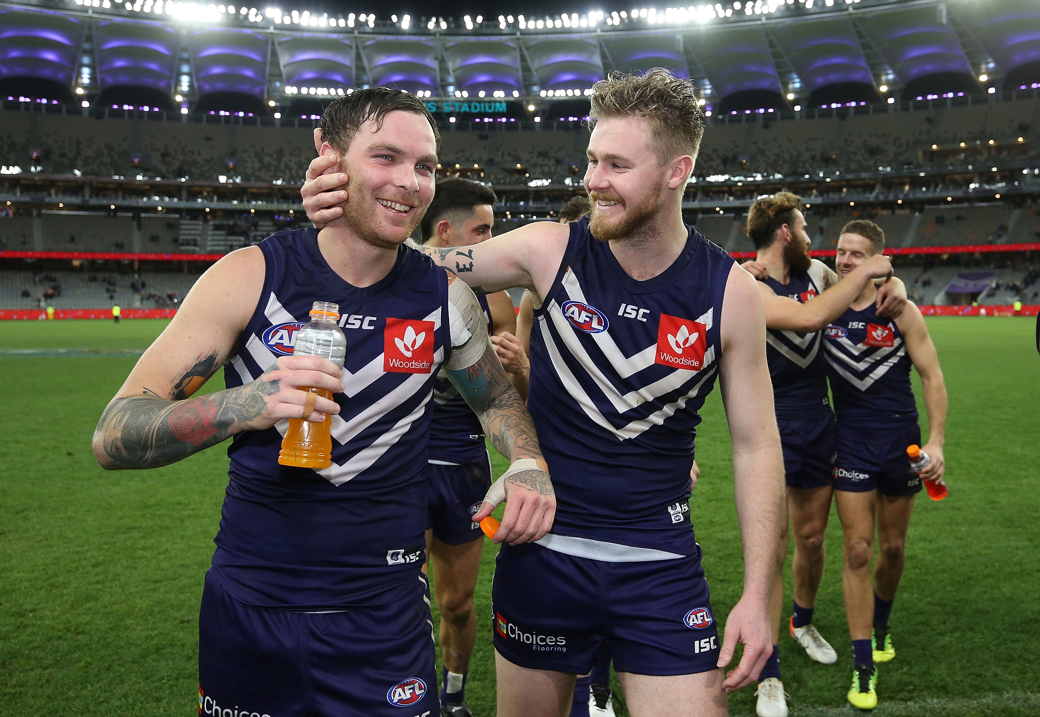 Nathan Wilson and Cam McCarthy of the Dockers walk from the field after winning the round 18 AFL match between the Fremantle Dockers and the Sydney Swans at Optus Stadium on July 20, 2019 in Perth, Australia. (Photo by Paul Kane/Getty Images)