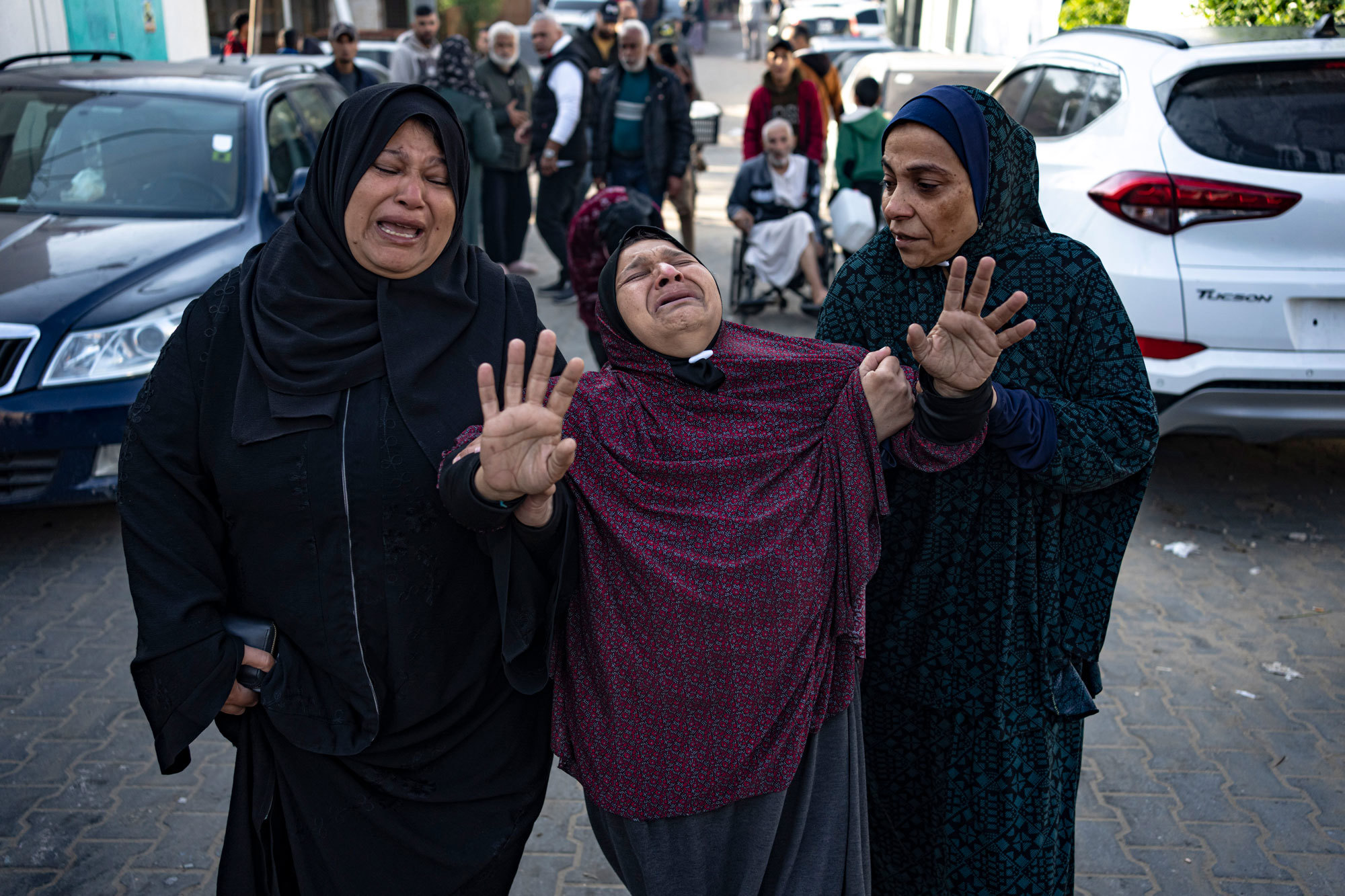 Palestinians mourn their relatives killed in the Israeli bombardment of the Gaza Strip, in the hospital in Khan Younis, Saturday, Dec. 2, 2023.