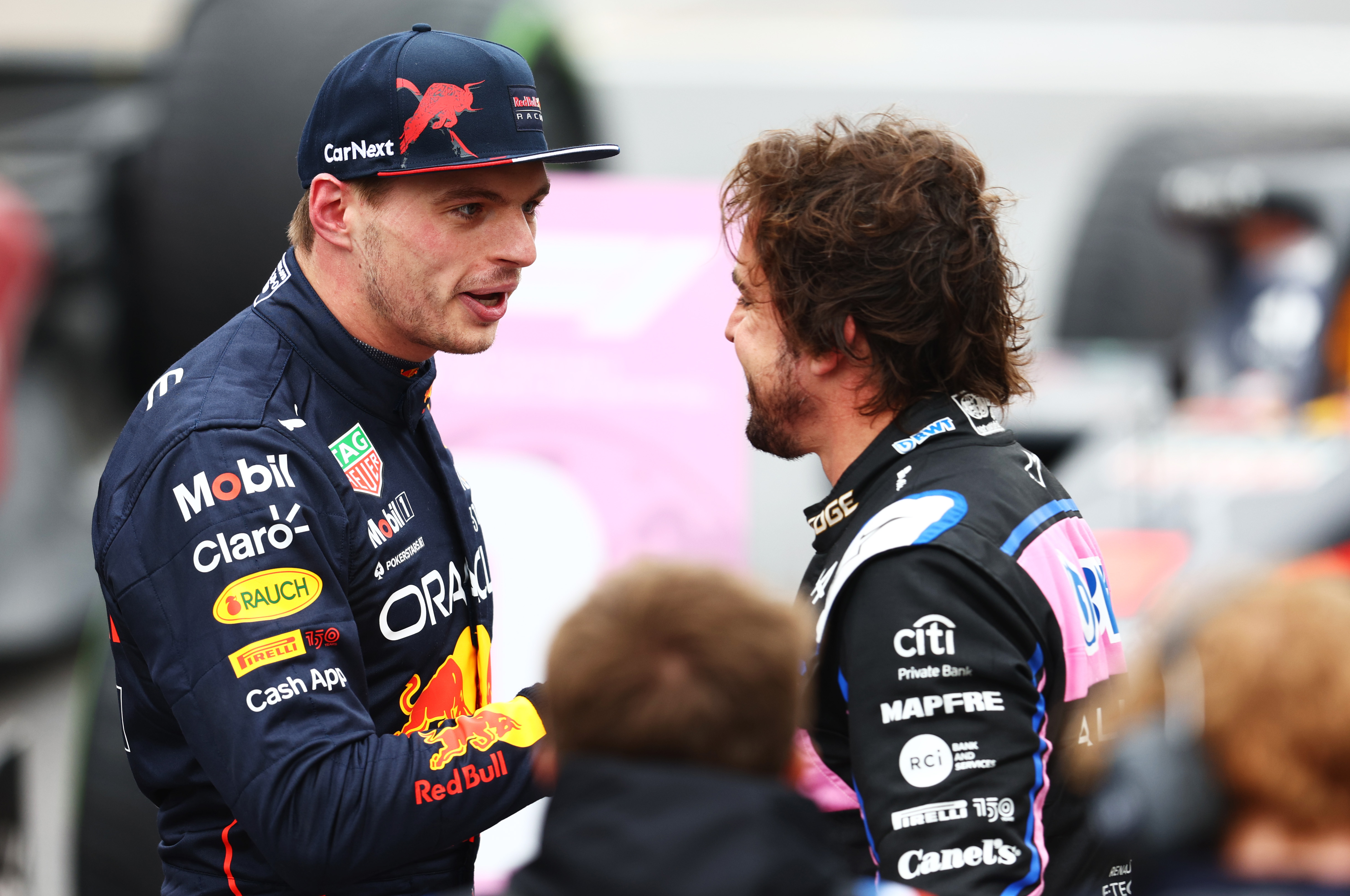 Pole sitter Max Verstappen congratulates second placed qualifier Fernando Alonso.
