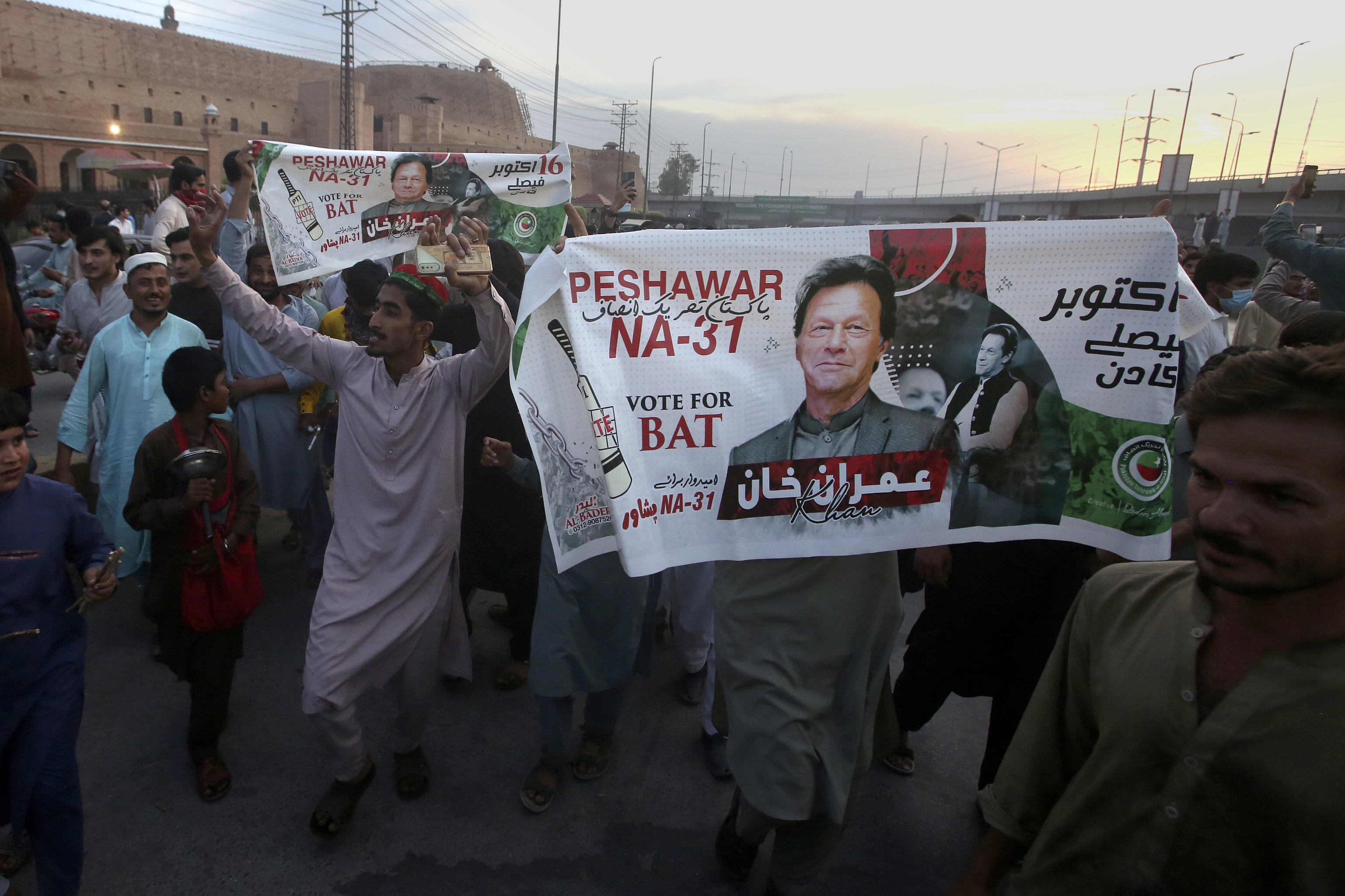 Supporters of Pakistan's former Prime Minister Imran Khan celebrate after Supreme Court decision, in Peshawar, Pakistan, Thursday, May 11, 2023.