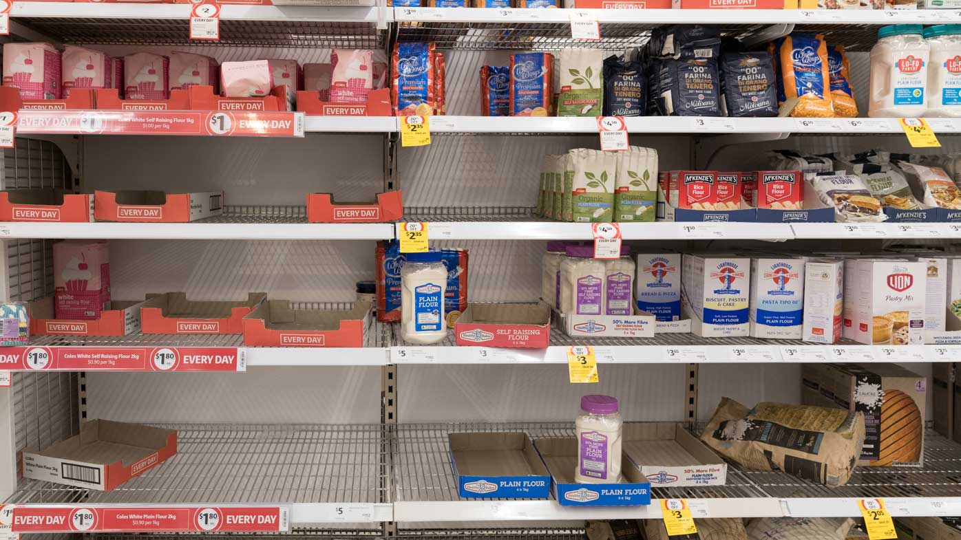 Depleted shelves of flour at the Coles supermarket in Woy Woy, NSW.