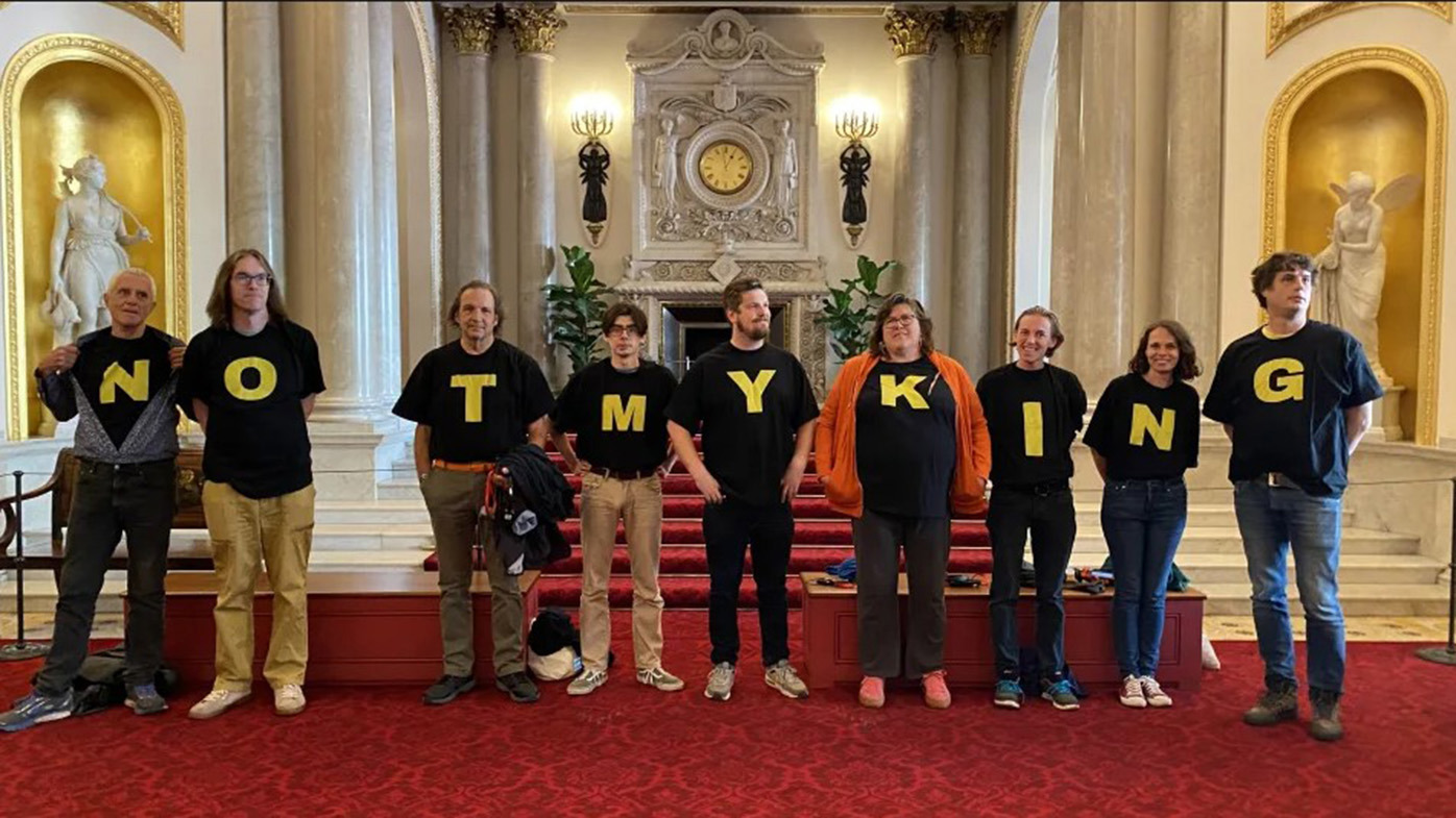 Members of anti-monarchist group Republic stage a protest inside Buckingham Palace.