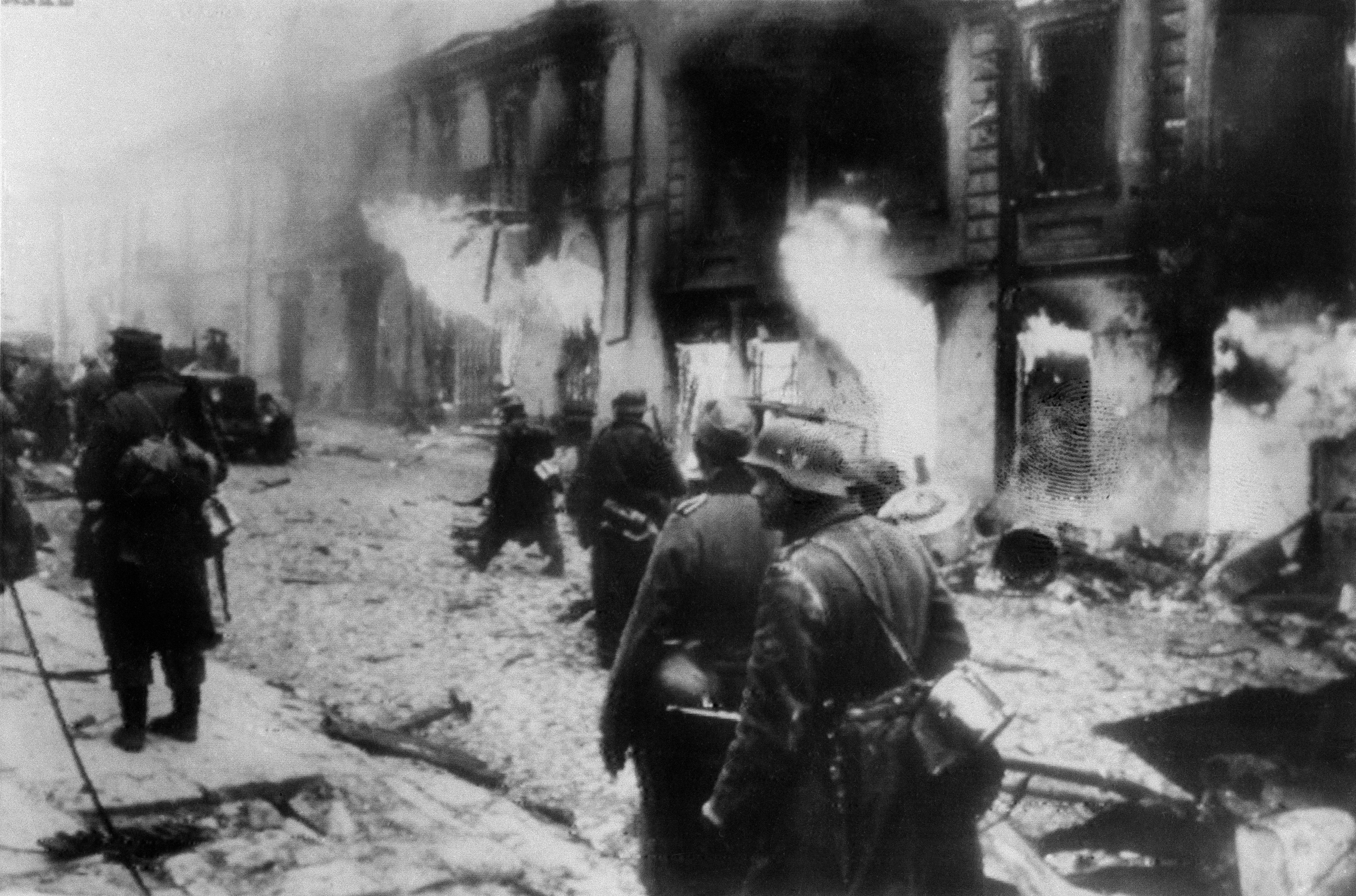 In this photo passed by Nazi censors and obtained by The Associated Press via neutral Swedish photo agency Pressens Bild, caption by the Nazis says it shows German soldiers penetrating one of Zhytomyr's streets in the Ukraine after recapture by the Nazis in the counter-offensive in the Kiev Bulge, Dec. 20, 1943. (Nazi Government/Buro Laux/Pressens Bild via AP)