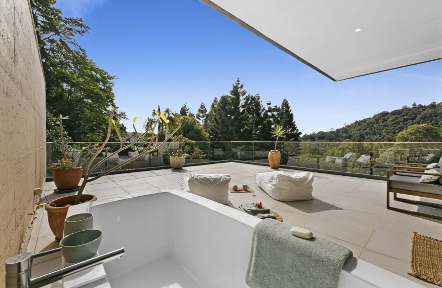 Homes on the market with bath tubs on the balconies.