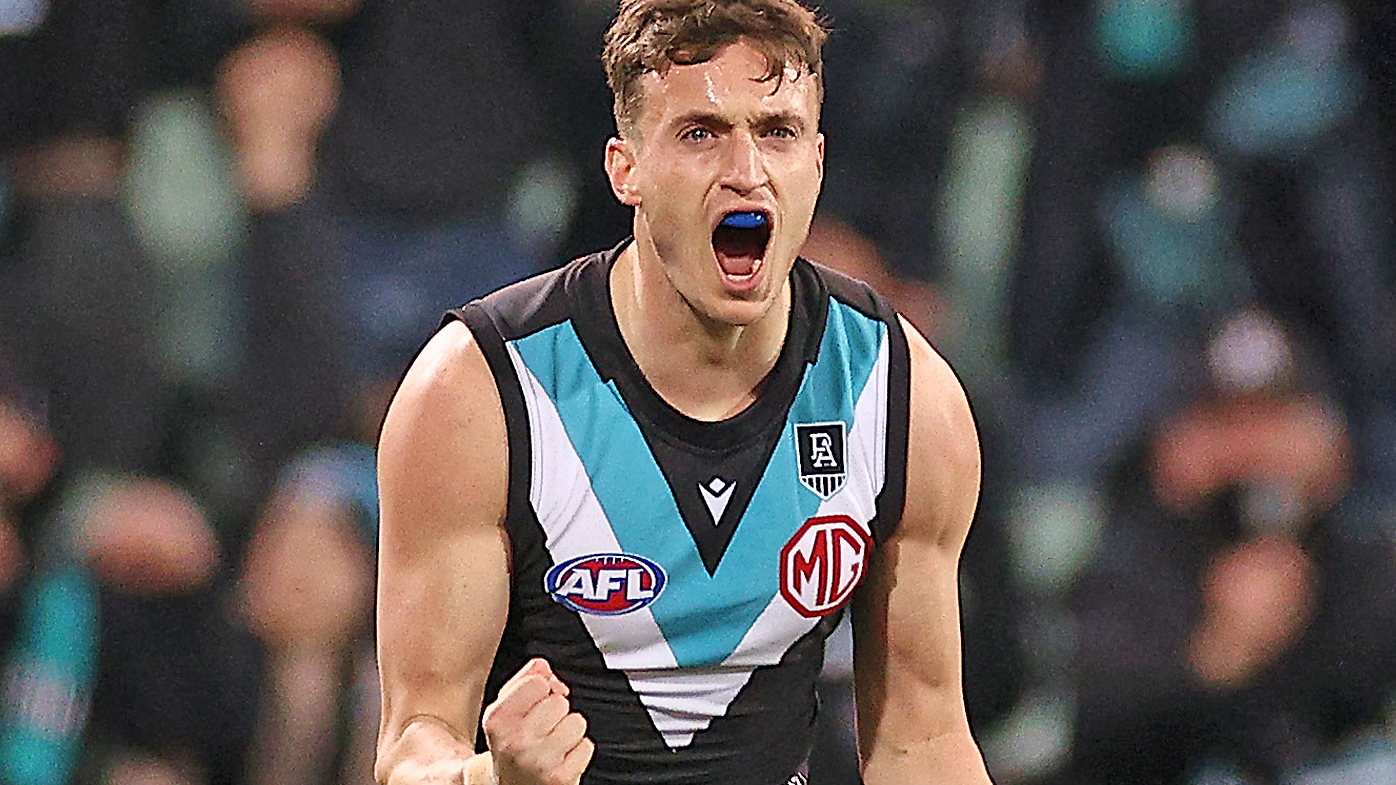  Orazio Fantasia of the Power celebrates kicking a goal 