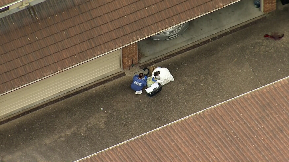 Police are investigating the woman's death, after the body was found in the unit block driveway