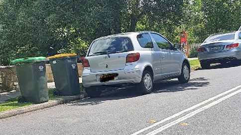 A photo provided by Revenue NSW which shows the car Cherie Frankel was renting parked illegally too close to the road's centre double line. 