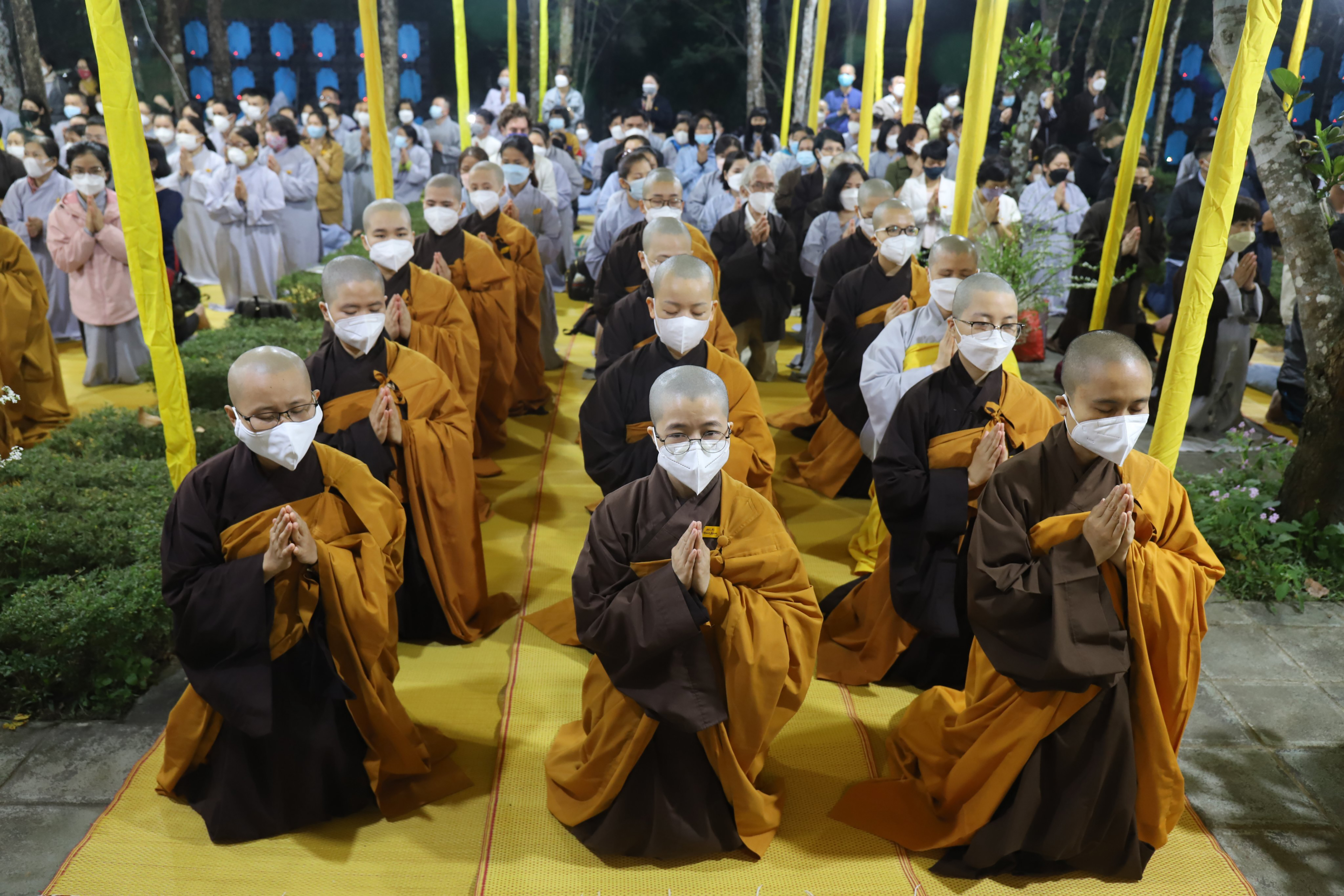 Monks and Thich Nhat Hanh followers pray during the funeral of the renowned monk in Hue, Vietnam on Saturday, Jan. 29, 2022. The Zen Master, who helped spread the practice of mindfulness in the West and socially engaged Buddhism in the East died on Jan. 22, 2022 at the age of 95. (AP Photo/Thanh Vo)