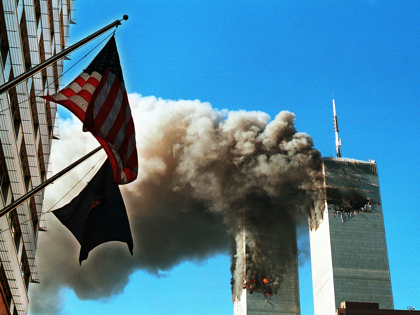 Dark, toxic smoke pours from the twin towers of the World Trade Center on September 11, after two hijacked planes hit each structure, later causing each to crash to the ground.