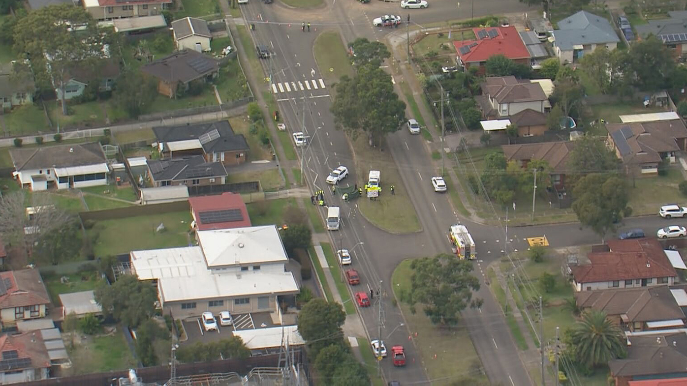 Police at the scene of the alleged road rage incident in Blackett.