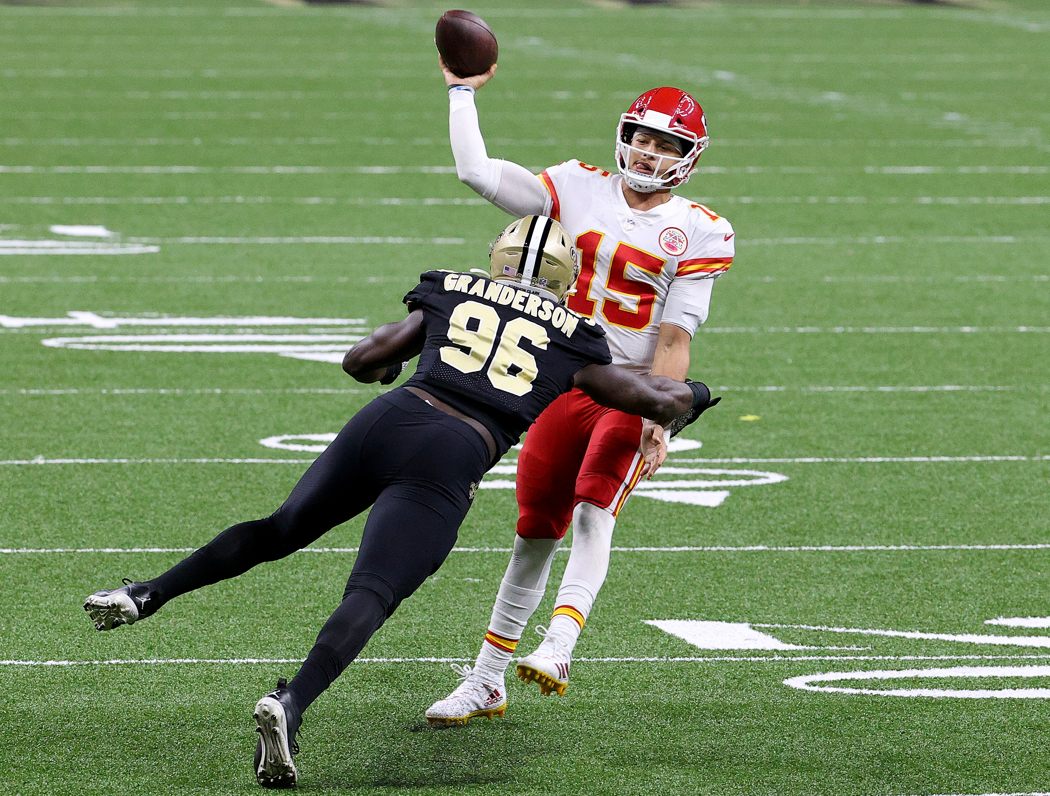Patrick Mahomes of the Kansas City Chiefs throws under pressure by Carl Granderson of the New Orleans Saints.