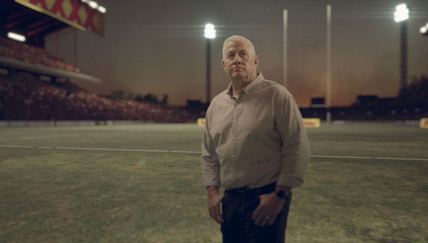 Chris Close in a scene from Nine's Origin opener that recreates Lang Park from 1980.