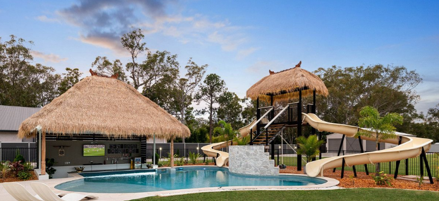 Elite resort-style property in Queensland with two waterslides and a swim-up bar sells for just over $2 million. 