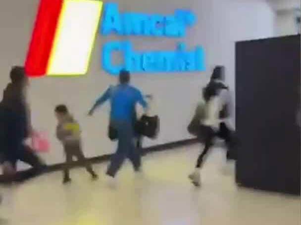 Police admitted it was a "frightening" situation for shoppers.Some were seen carrying young children and running with prams.