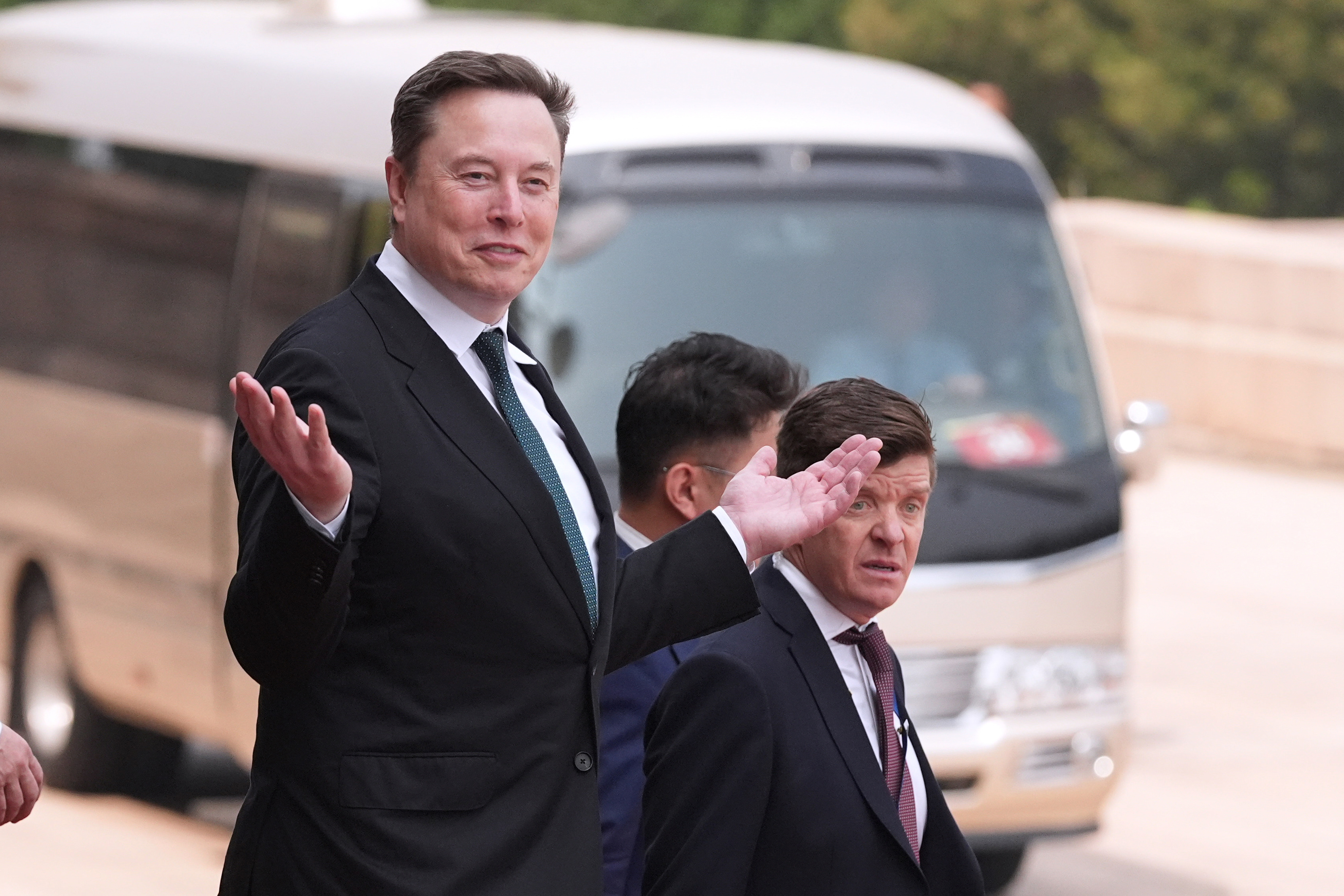 Elon Musk departs after a welcome ceremony with President Donald Trump and China's President Xi Jinping at the Great Hall of the People, Thursday, May 14, 2026, in Beijing.