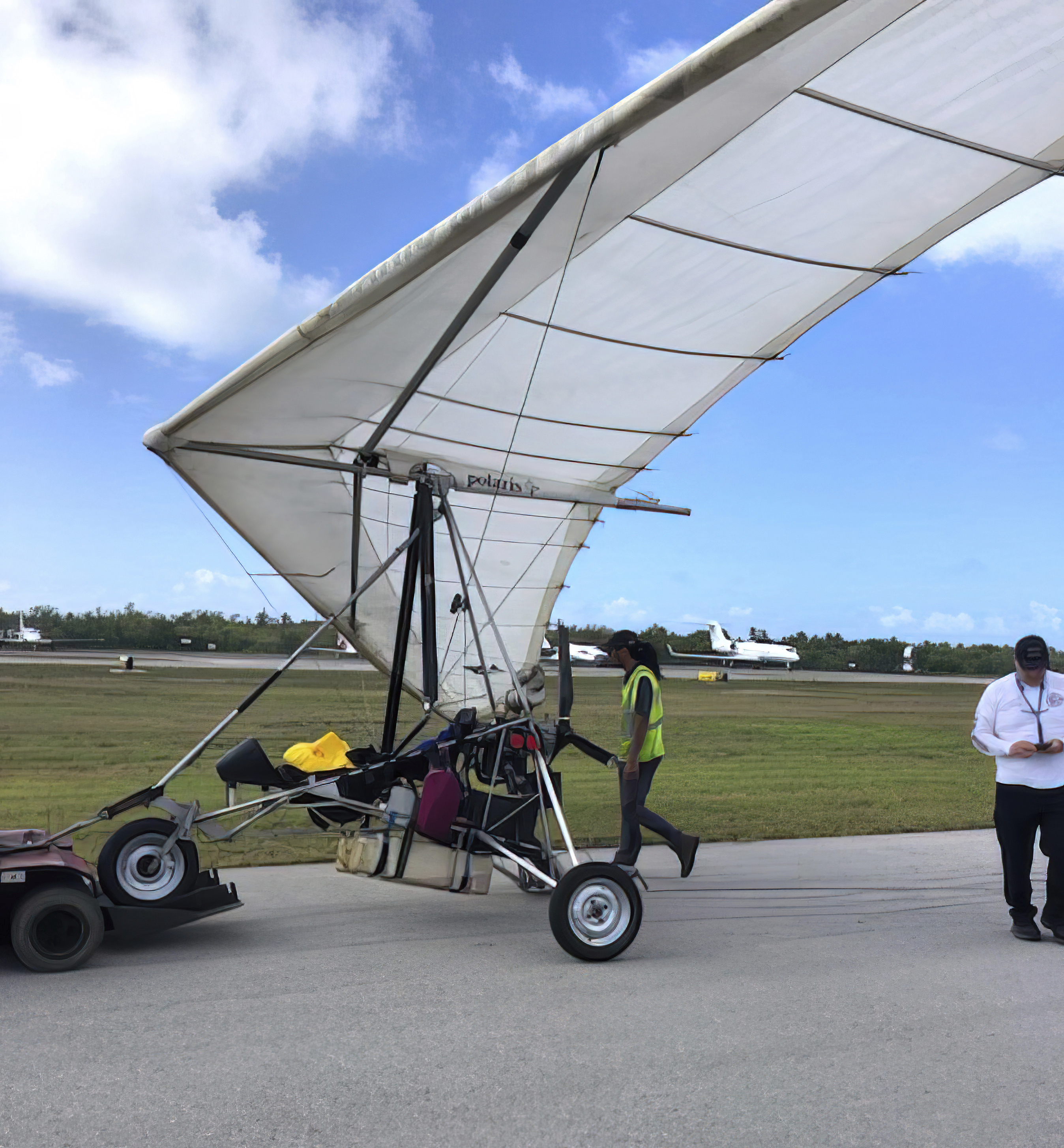 Personnel examine an ultralight aircraft that landed illegally at the airport carrying two Cuban men Saturday, March 25, 2023, in Key West, Florida.