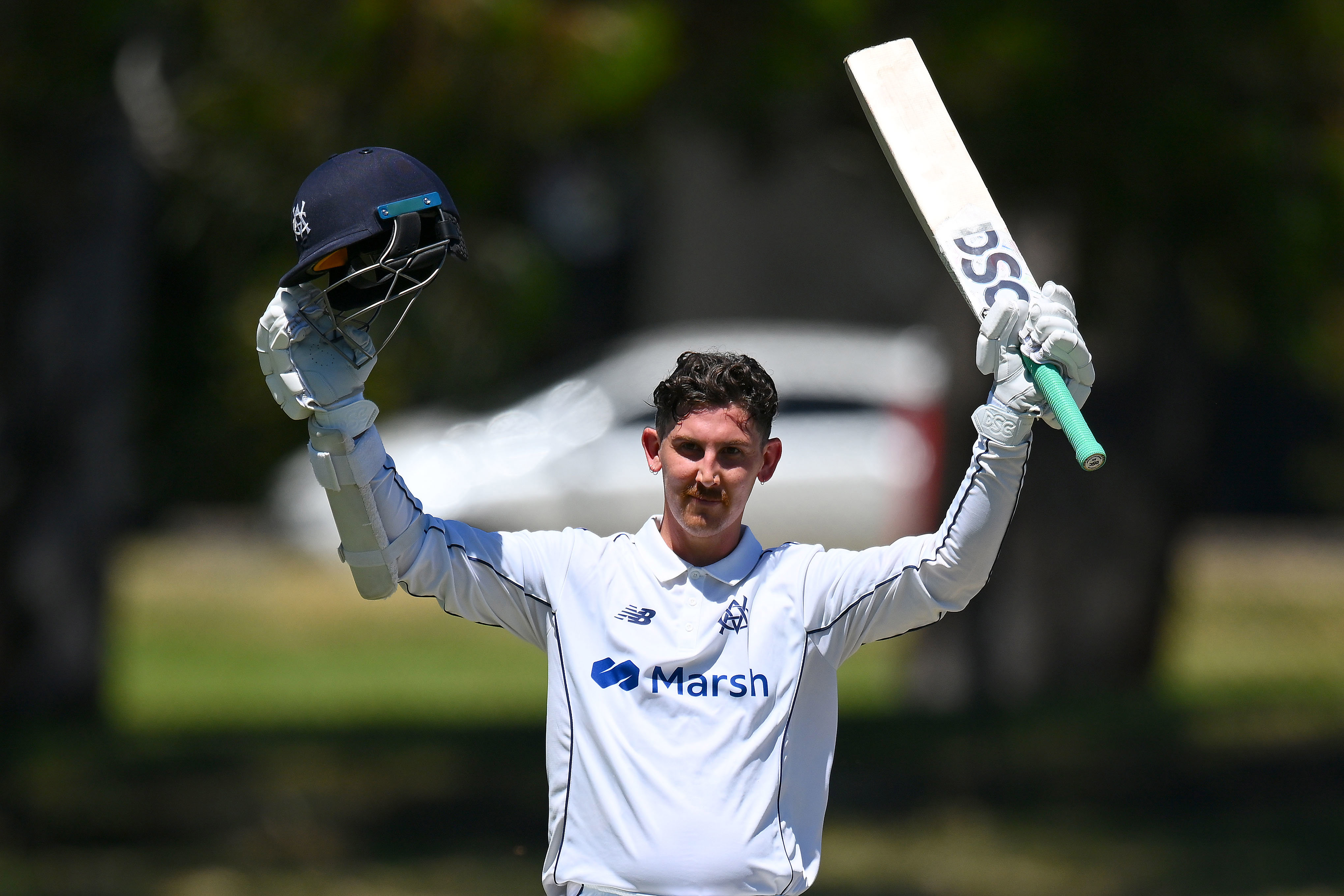 Nic Maddinson of Victoria celebrates scoring a century during the Sheffield Shield match between Victoria and South Australia at CitiPower Centre, on February 04, 2024, in Melbourne, Australia. (Photo by Morgan Hancock/Getty Images)