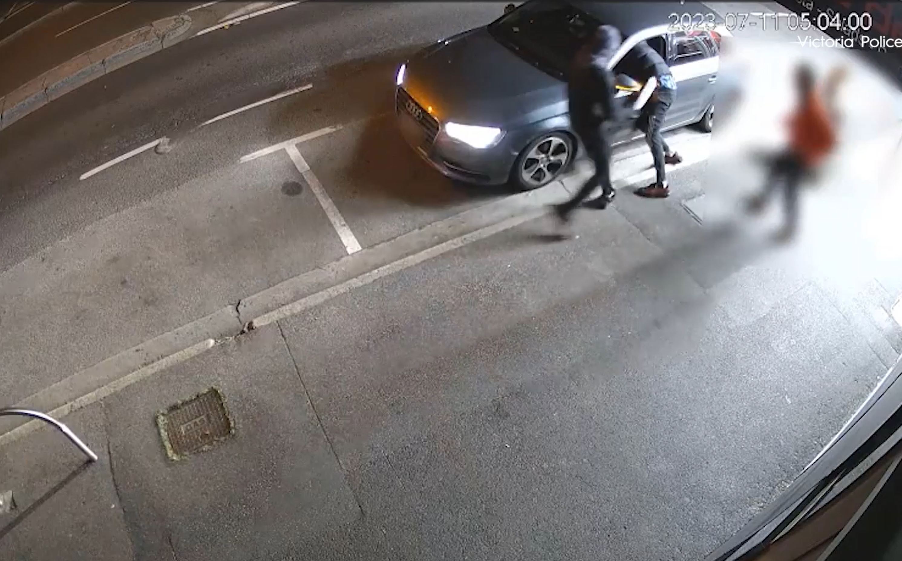 A terrifying armed robbery, in which a driver was cut by a machete after a stranger climbed into his car, on a Melbourne street was captured ﻿on CCTV. Police have released the footage as they search for men behind the incident.