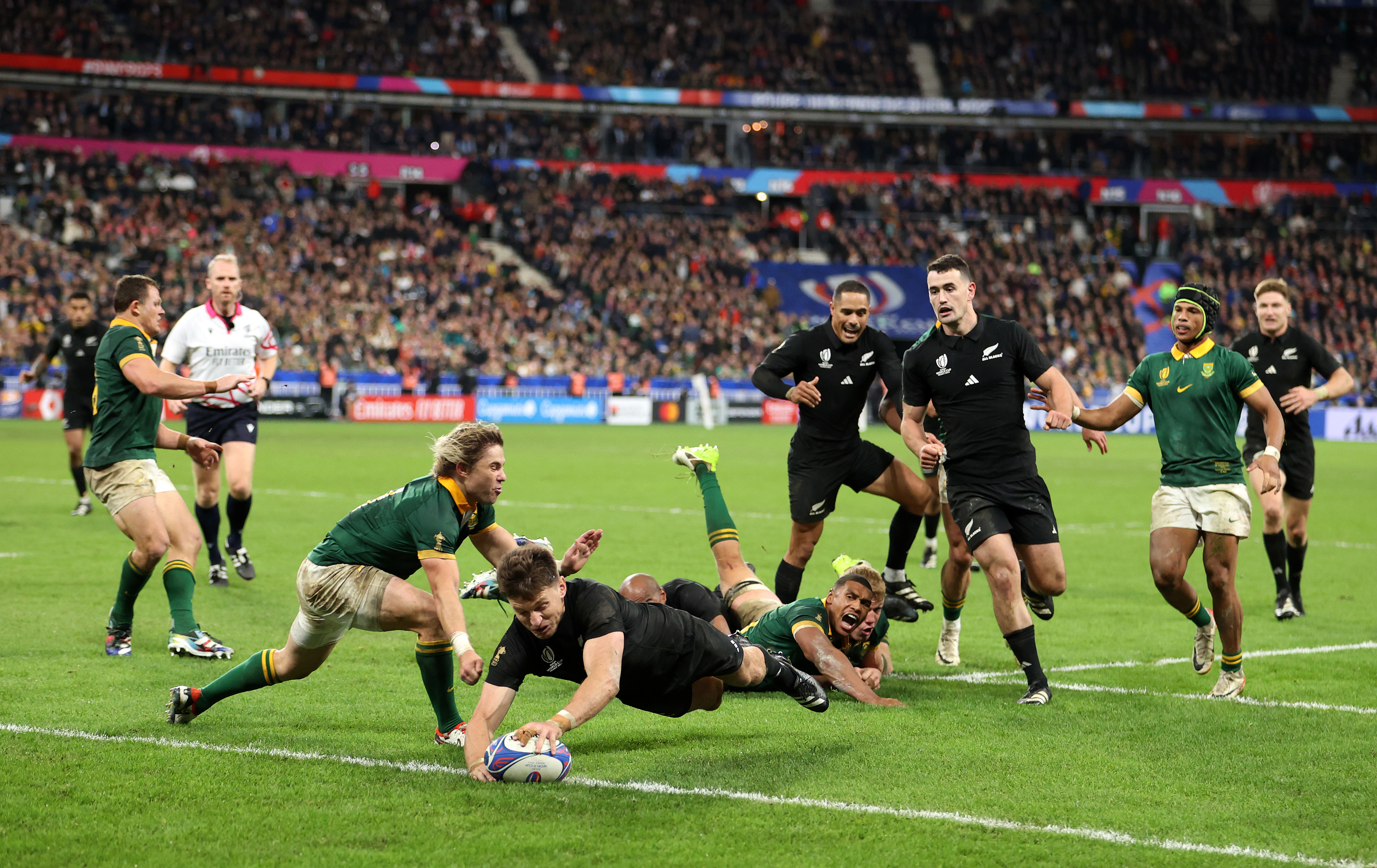 Beauden Barrett of New Zealand scores his team's first try.