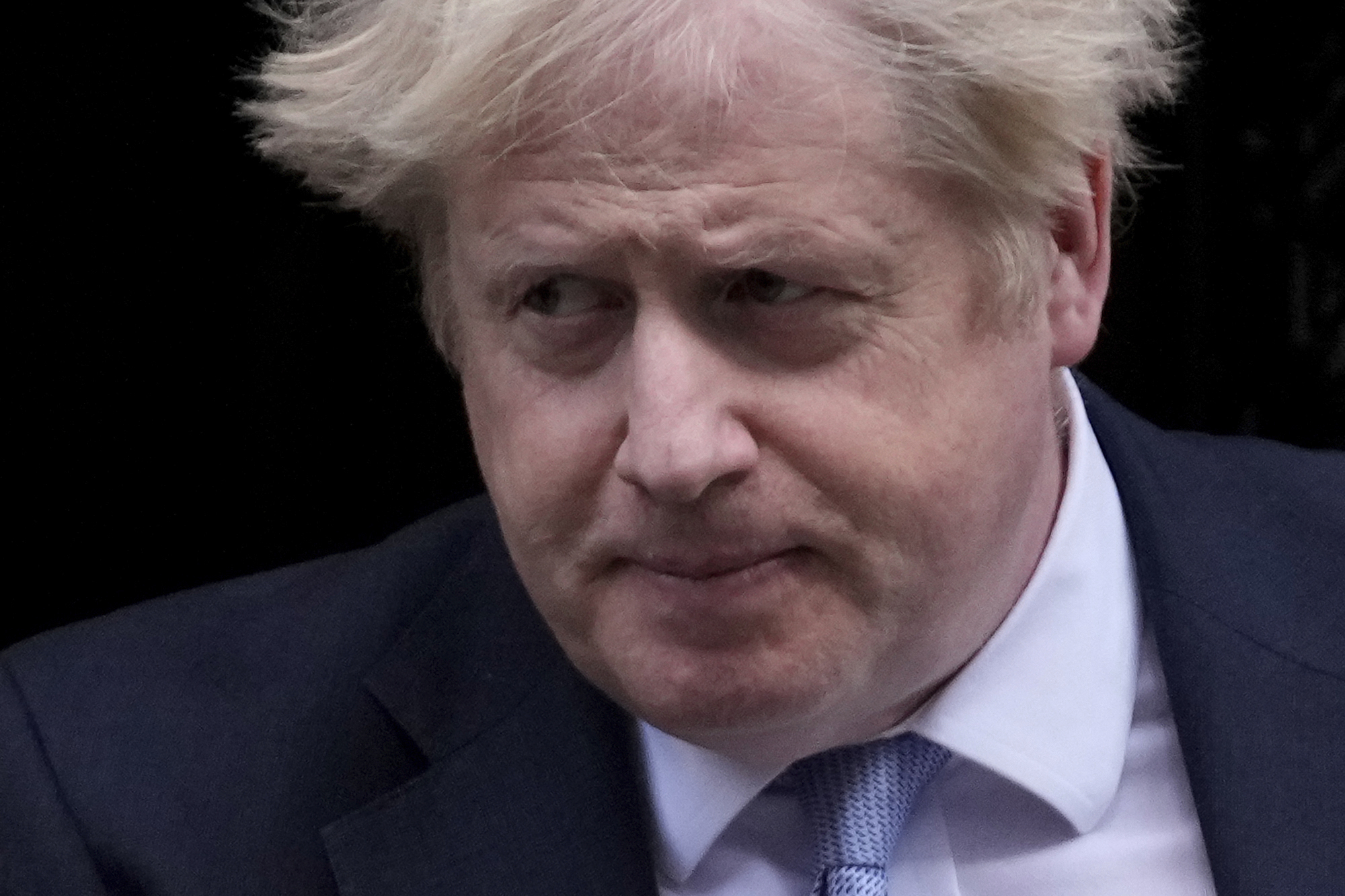 British Prime Minister Boris Johnson leaves 10 Downing Street to attend the weekly Prime Minister's Questions at the Houses of Parliament, in London, Wednesday, February 9, 2022.
