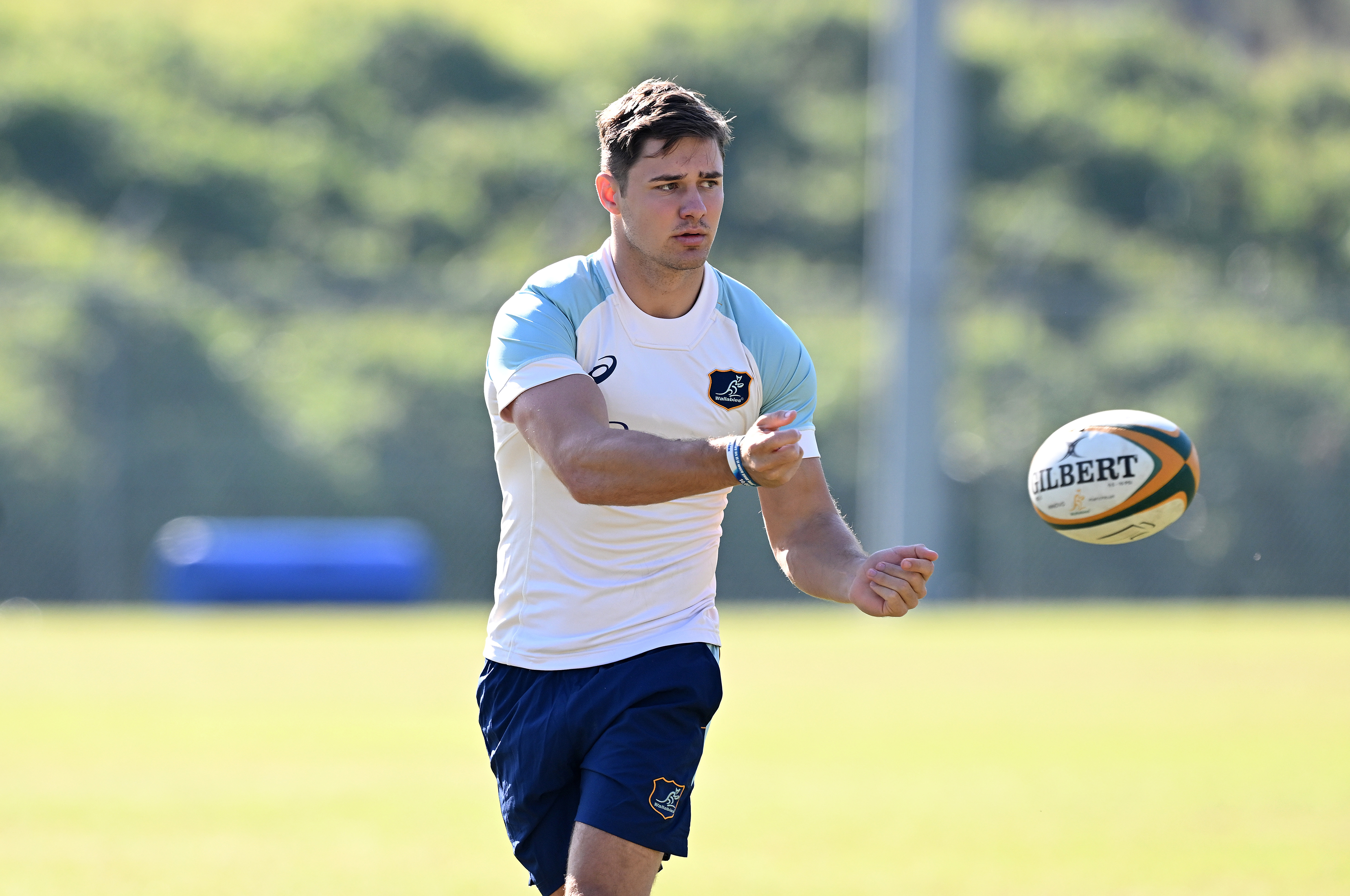 Josh Flook passes the ball during a Wallabies training session at Ballymore Stadium.