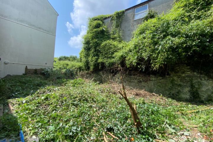 Derelict riverfront cottage on the market for $2