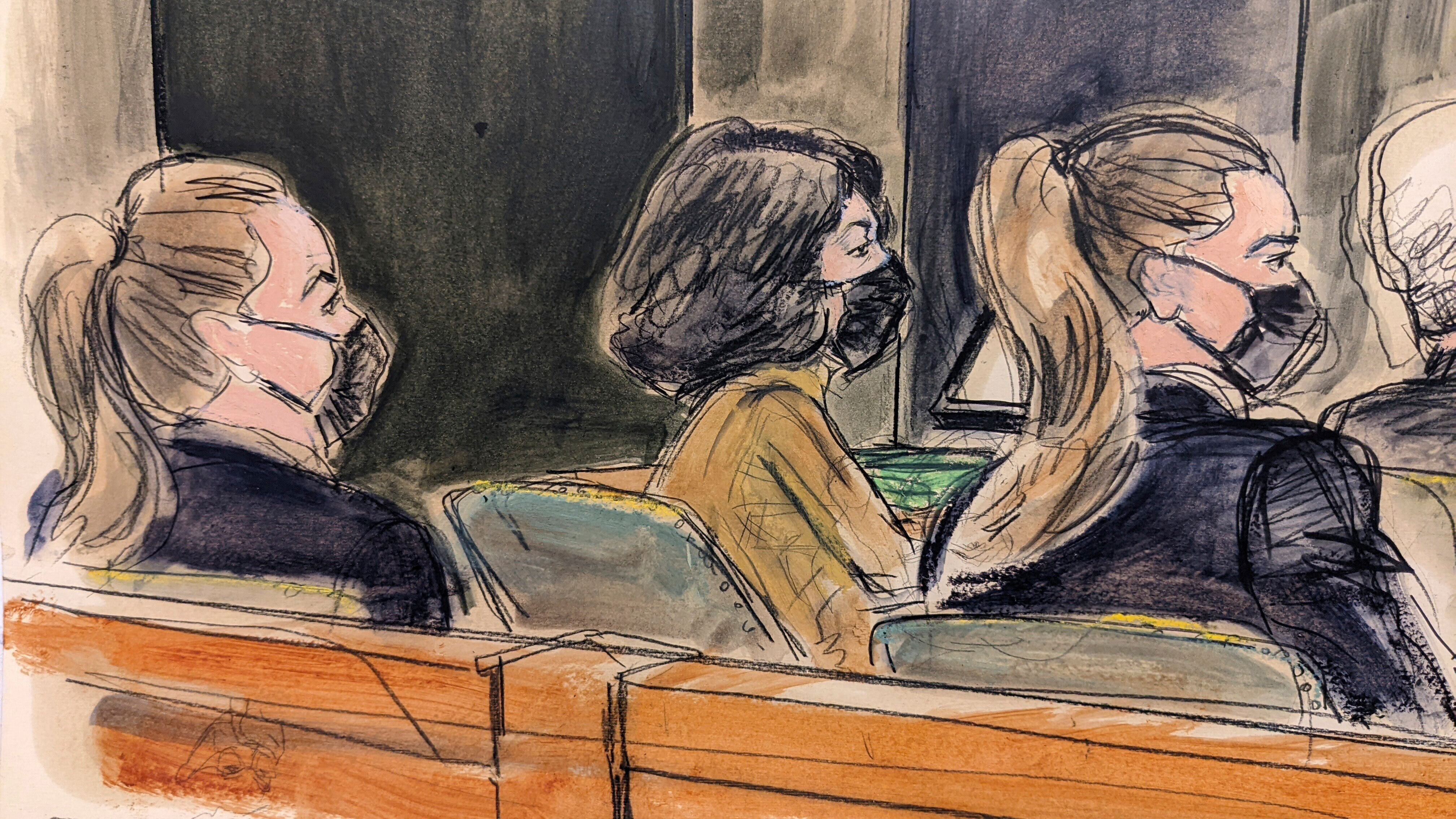 This courtroom sketch shows Ghislaine Maxwell, centre, seated in court at defence table between two US Marshals seated in foreground, watching proceedings in her sex abuse trial in New York.