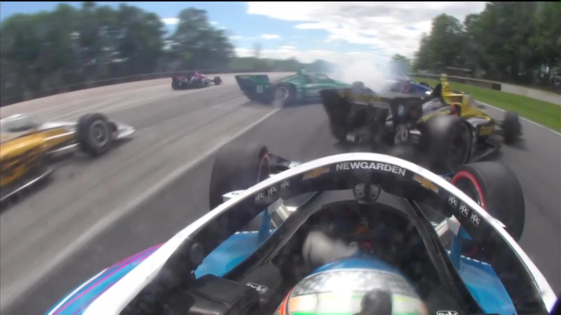 Josef Newgarden tips Colton Herta into a spin.