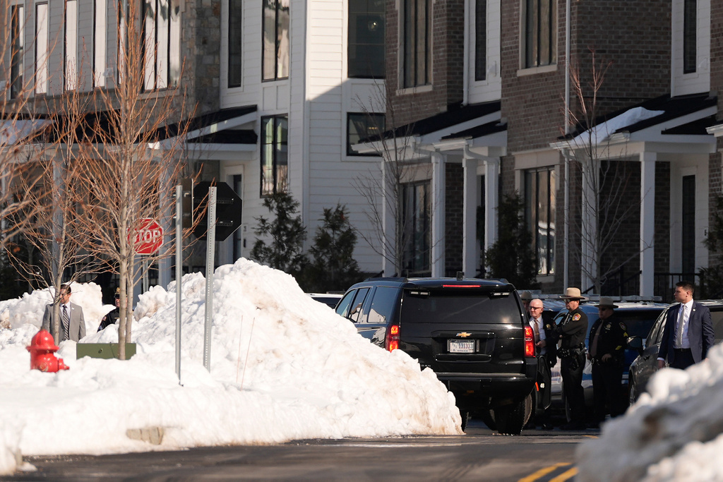 A motorcade carrying former US Secretary of State Hillary Clinton 