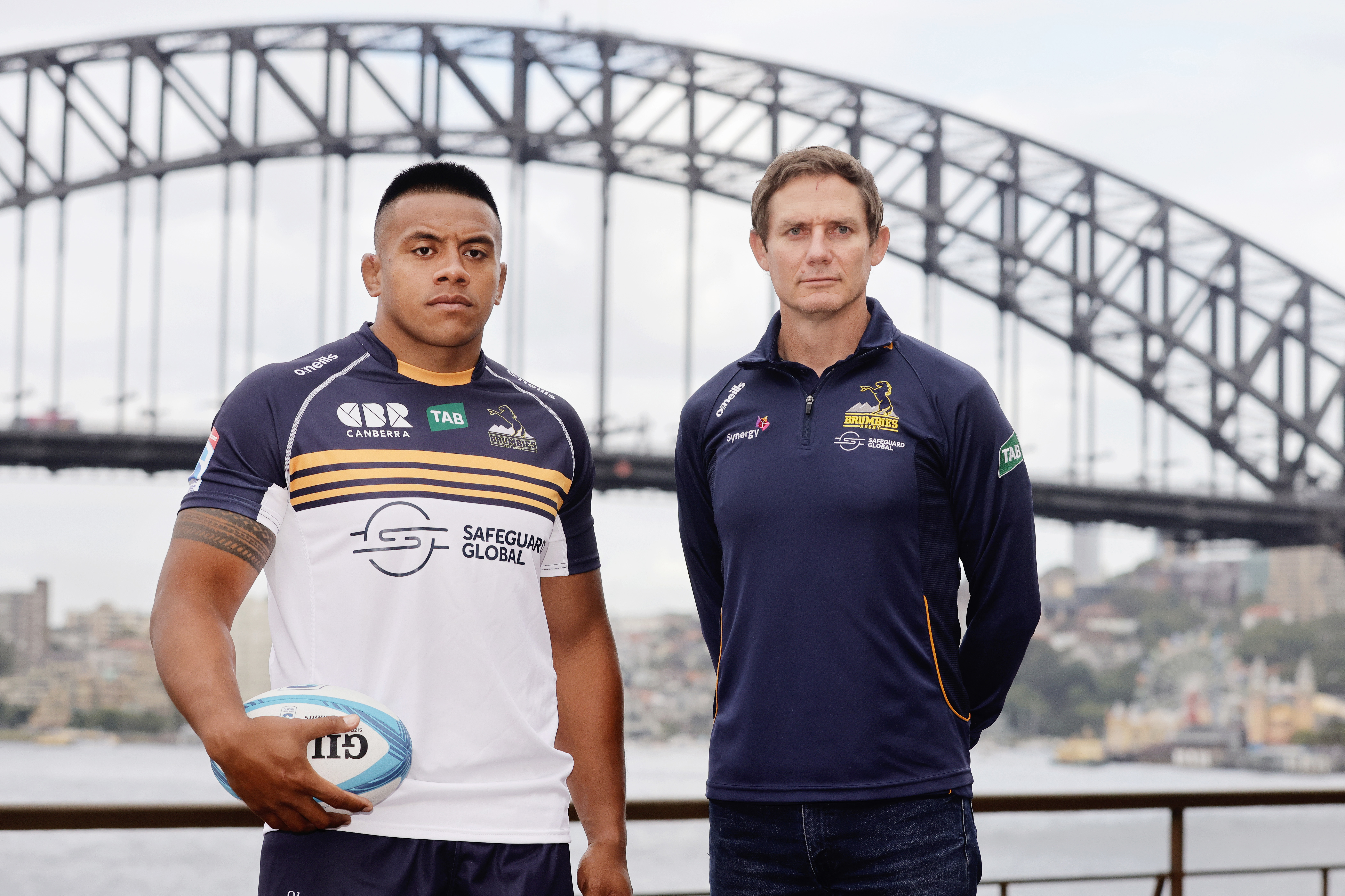 Allan Alaalatoa of the ACT Brumbies poses with coach Stephen Larkham.