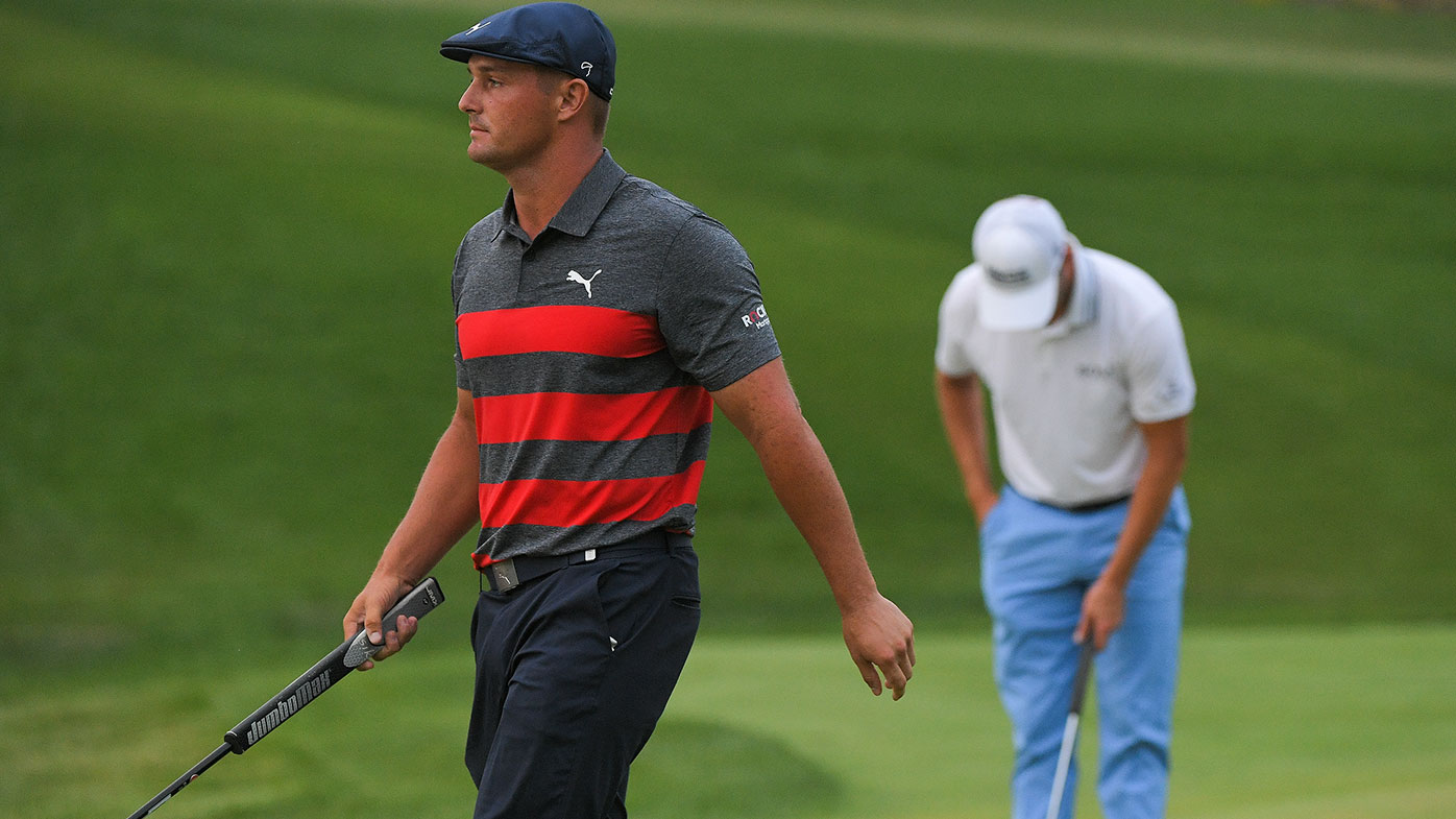 Bryson DeChambeau and Patrick Cantlay finish playing the 17th green for the fifth playoff hole during the final round of the BMW Championship at Caves Valley Golf Club on August 29, 2021 in Owings Mills, Maryland