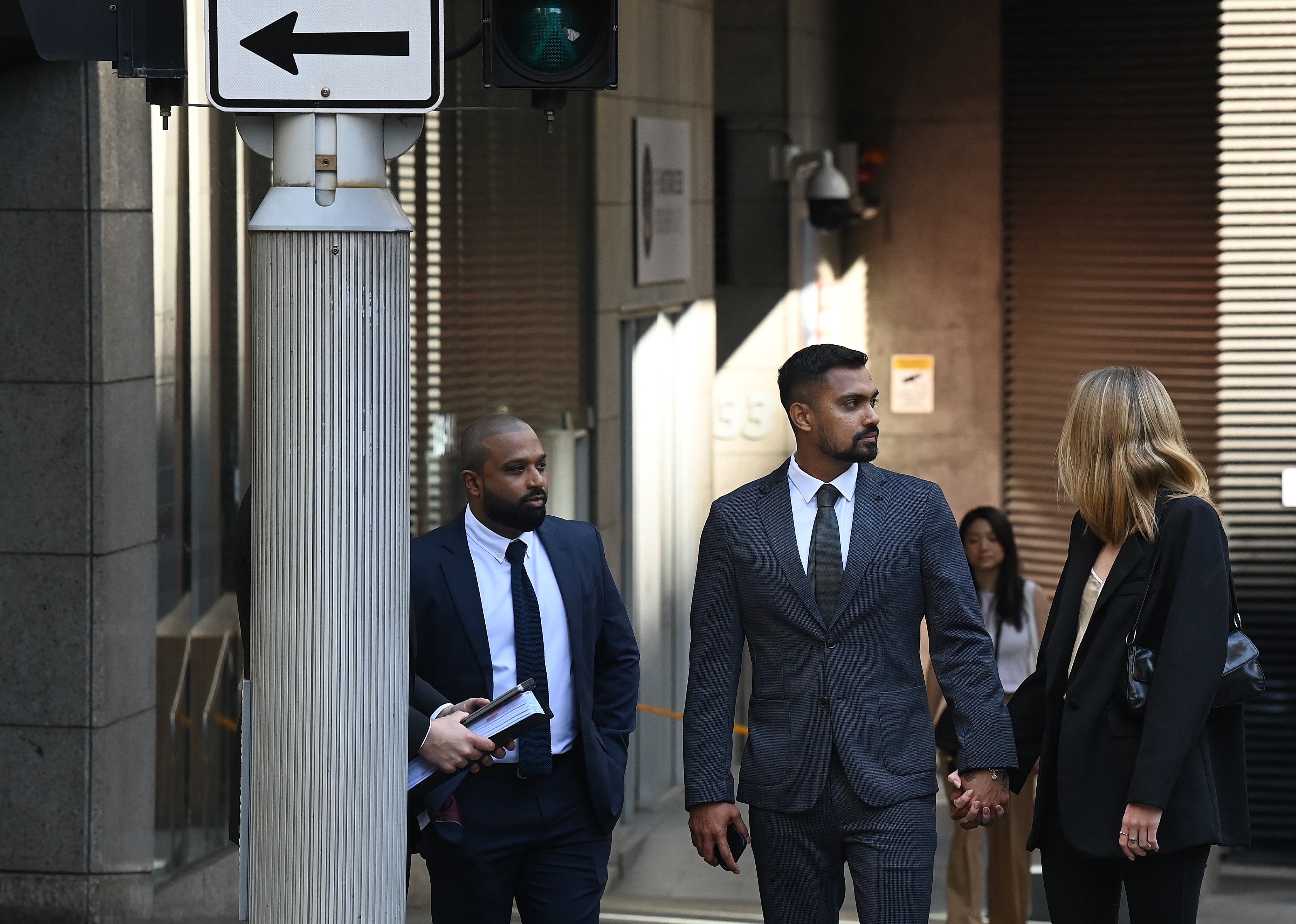Sri Lankan cricketer Danushka Gunathilaka (centre) accused of sexually assaulting a woman in Sydney in November 2022, arrives at Downing Centre District Court to face a judge-alone trial. September 18, 2023. Photo: Kate Geraghty