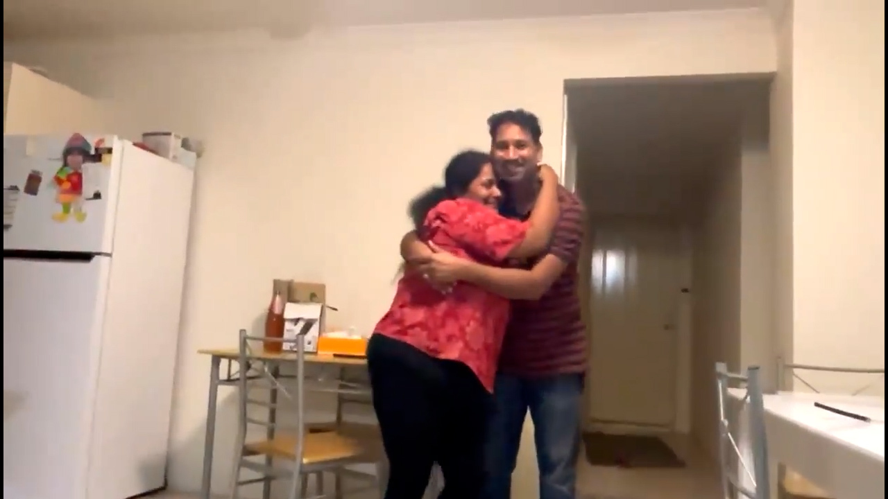 Priya and Nades Murugappan  embraced after learning of the federal election results.