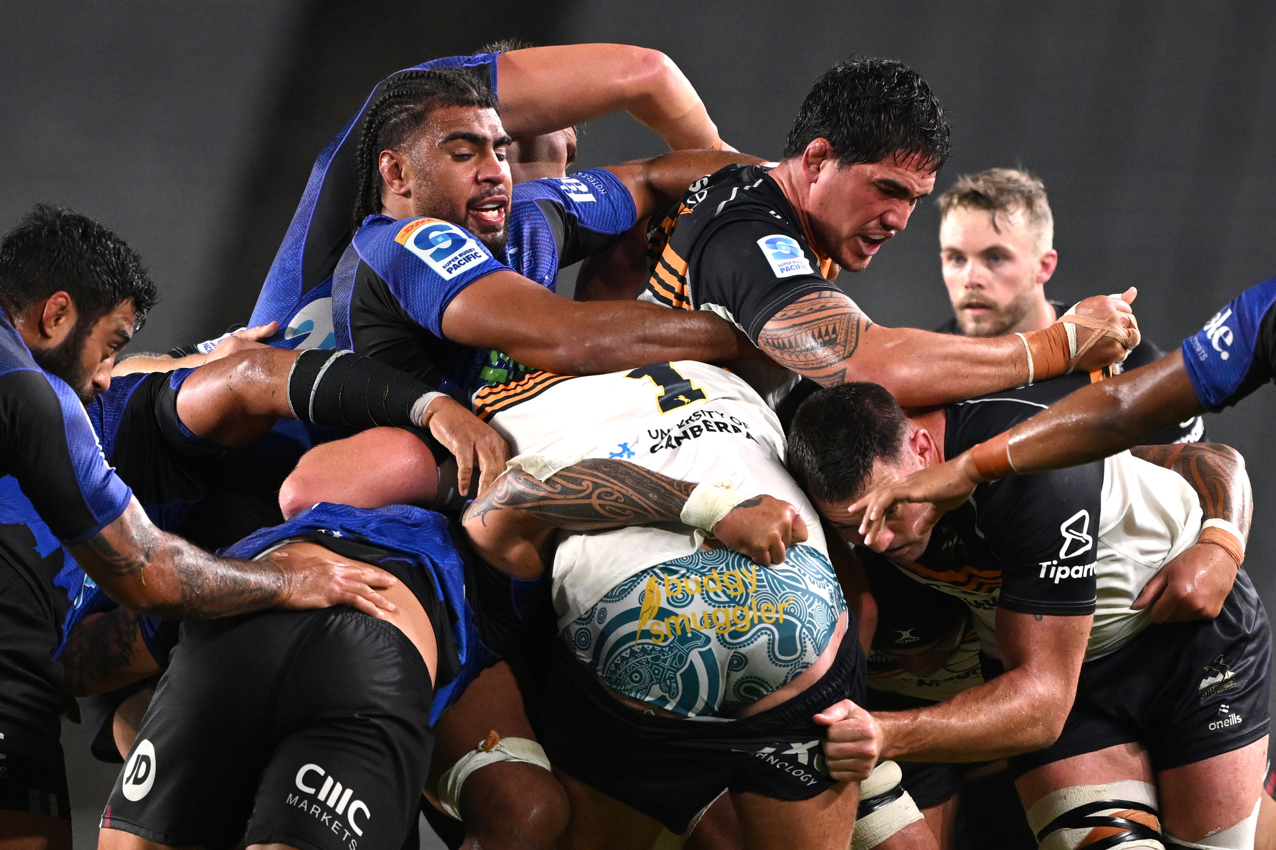 Hoskins Sotutu of the Blues tackles Darcy Swain of the Brumbies.