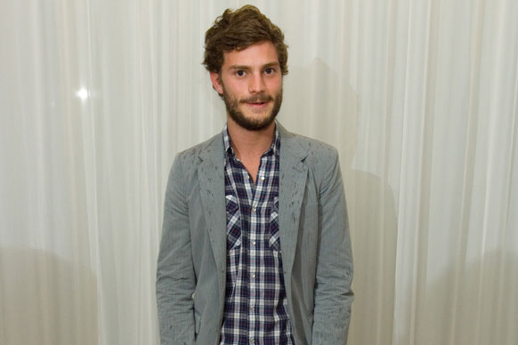 <i>Fifty Shades</i> hottie Jamie Dornan was born on May 1, 1982 in Belfast, Northern Ireland to obstetrician Jim and homemaker Lorna.<br/><br/>He has two older sisters, Leisa and Jessica and was raised in the well-off suburb of Holywood in County Down.<br/><br/>Image: Getty