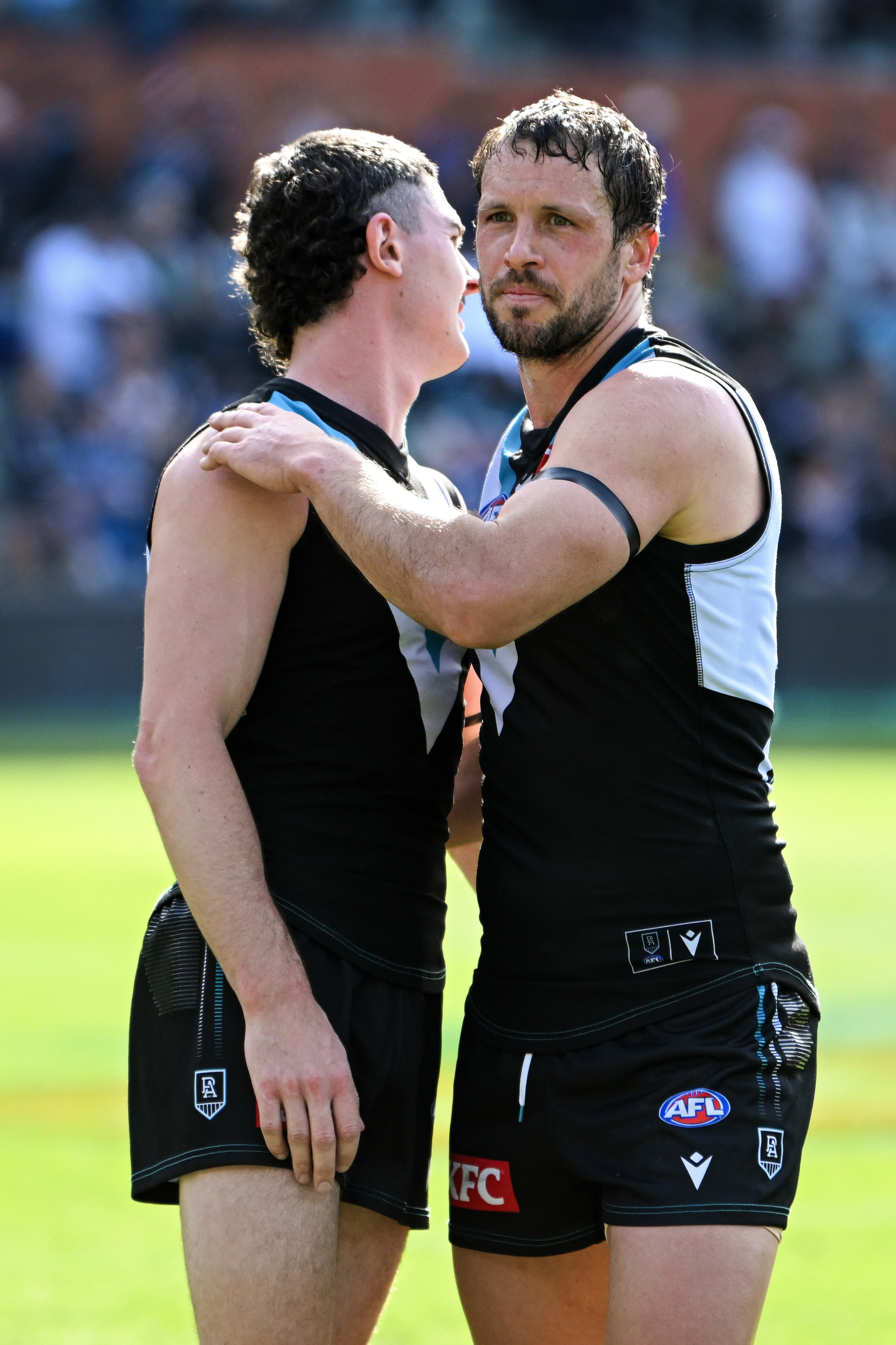 Darcy Byrne-Jones and Travis Boak celebrate  Port Adelaide's round 24 win over Richmond.