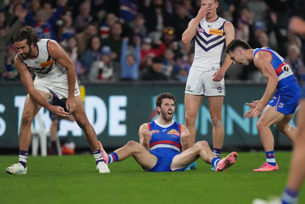 Western Bulldogs and Fremantle Dockers; Marcus Bontempelli celebrates kicking a goal.