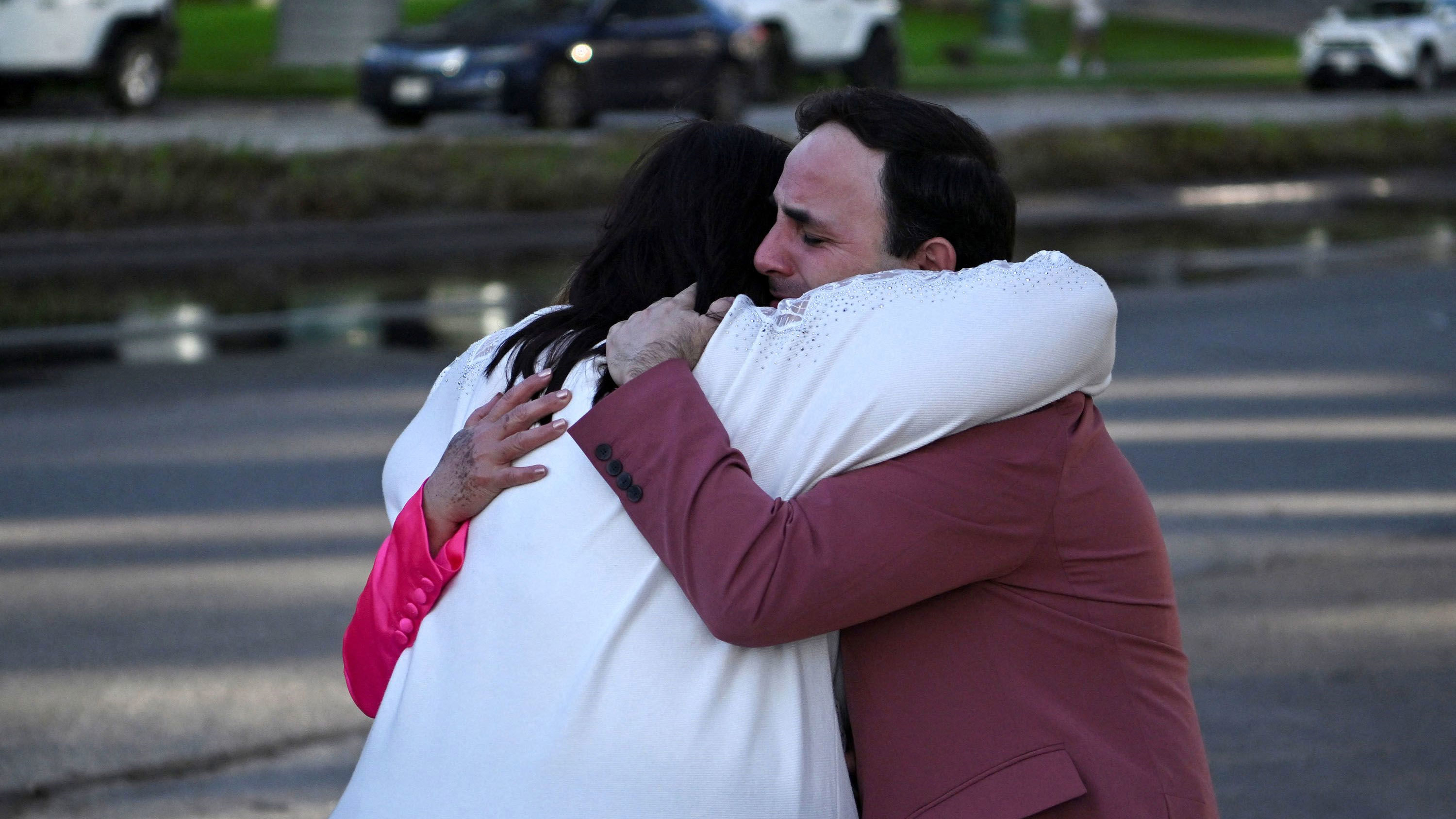 Carlos Gonzalez, a worship singer, hugs a fellow churchgoer after a shooting at Joel Osteen's Lakewood Church in Houston.