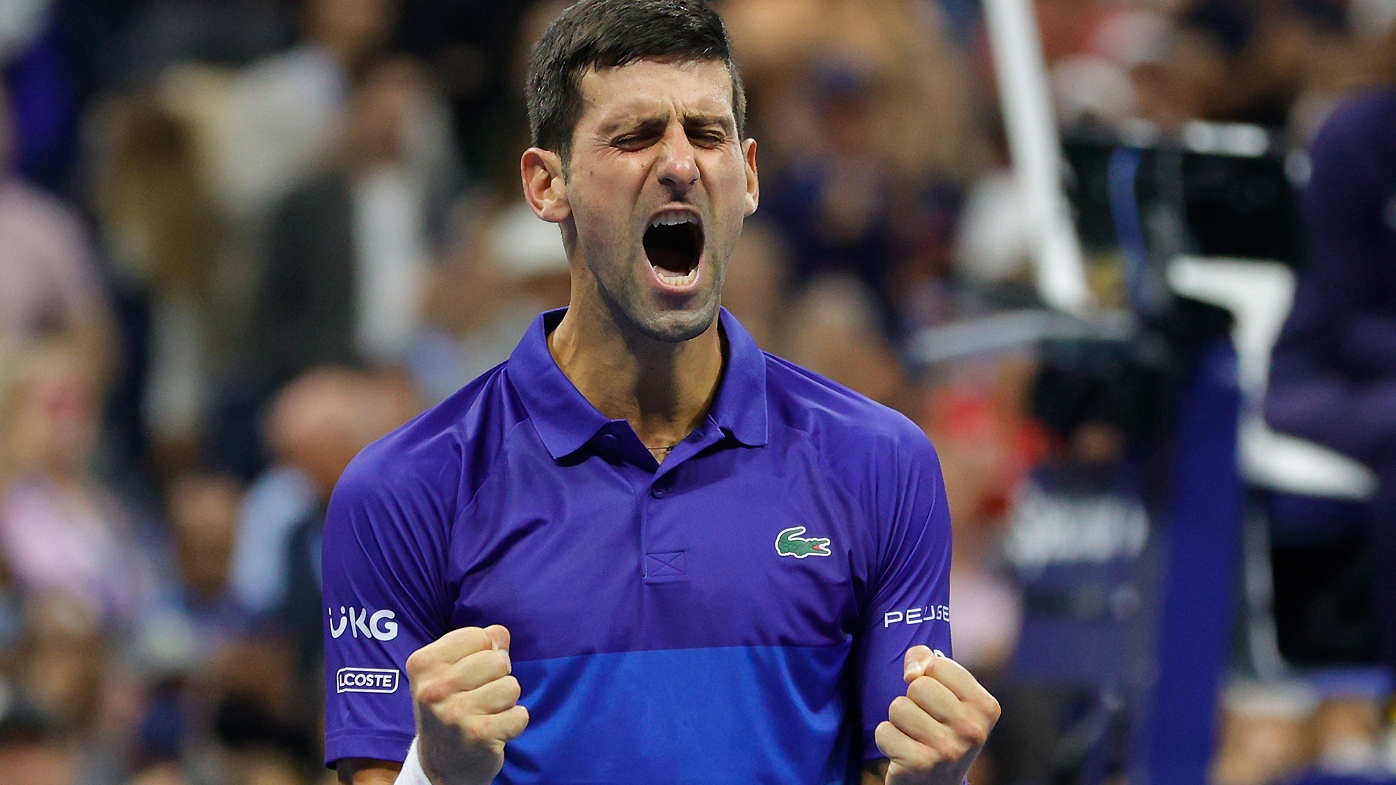 Novak Djokovic of Serbia celebrates winning match point to defeat Alexander Zverev of Germany