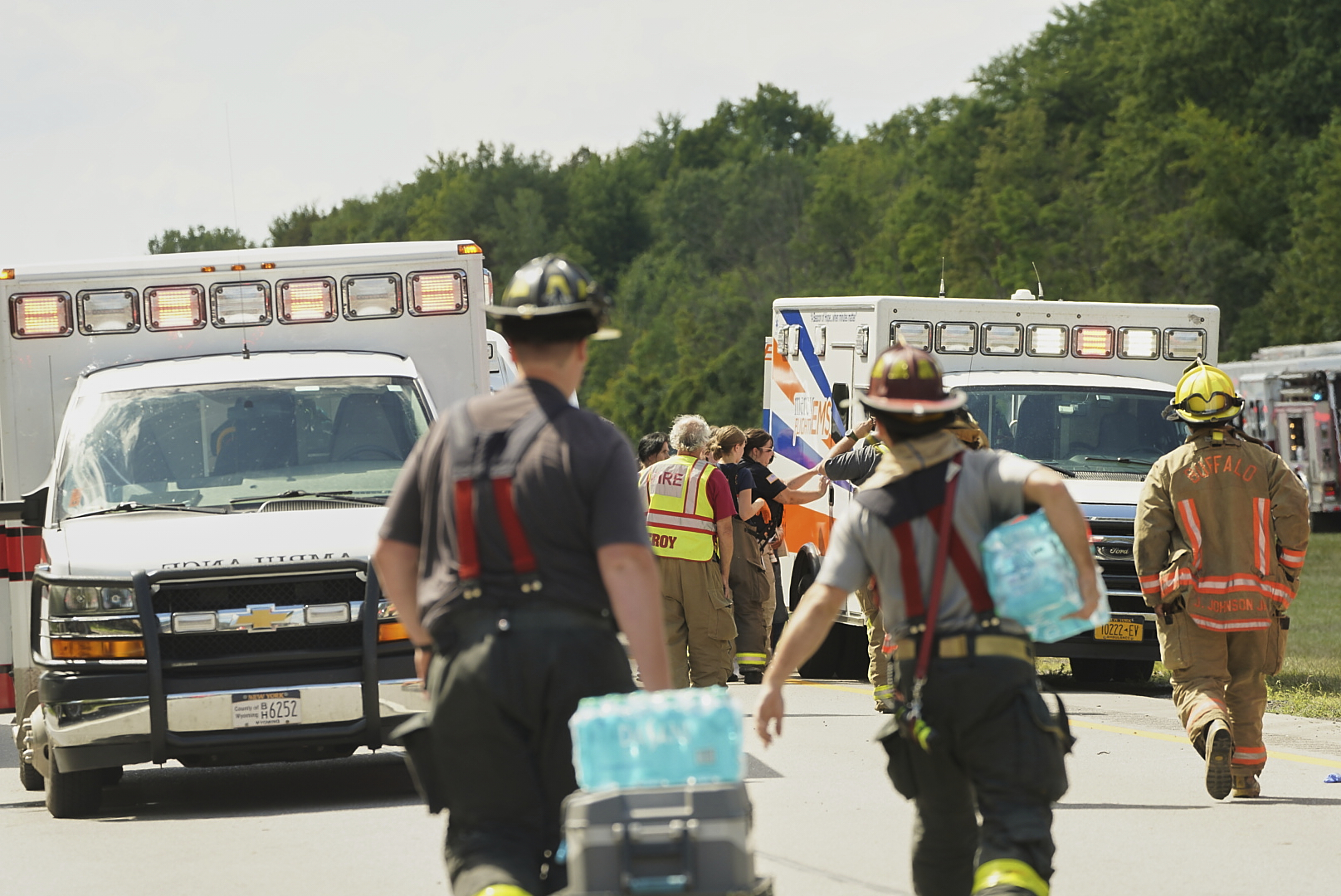 Rescue personnel work the scene of a tour bus that crashed and rolled over on the New York State Thruway near Pembroke, N.Y., Friday, Aug. 22, 2025. (Libby March/The Buffalo News via AP)