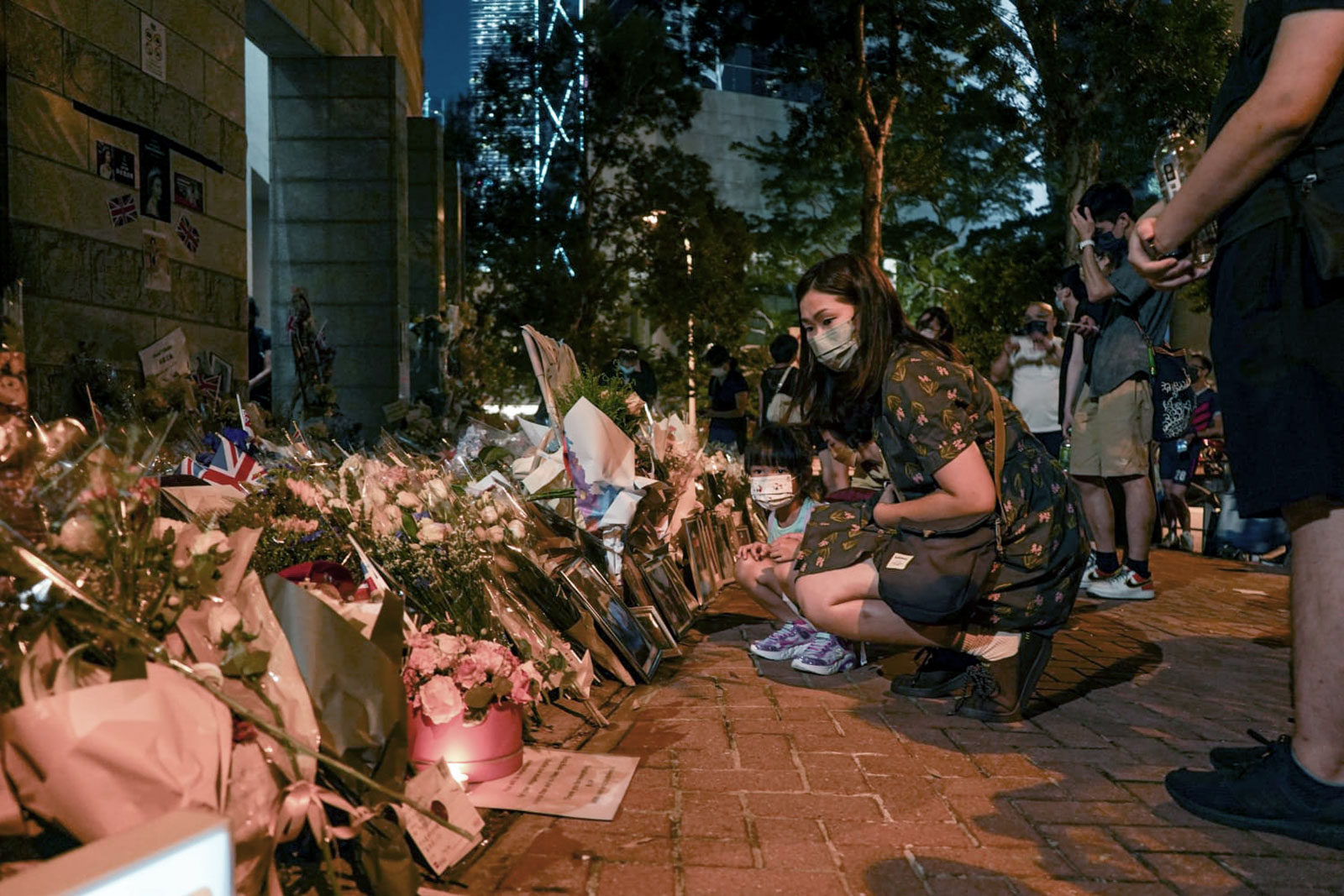 Over 2,500 people lined up to offer condolences to Queen Elizabeth II outside the British consulate in Hong Kong on September 12.