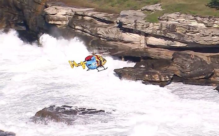 A search has resumed for a 24-year-old swept off rocks in Sydney.