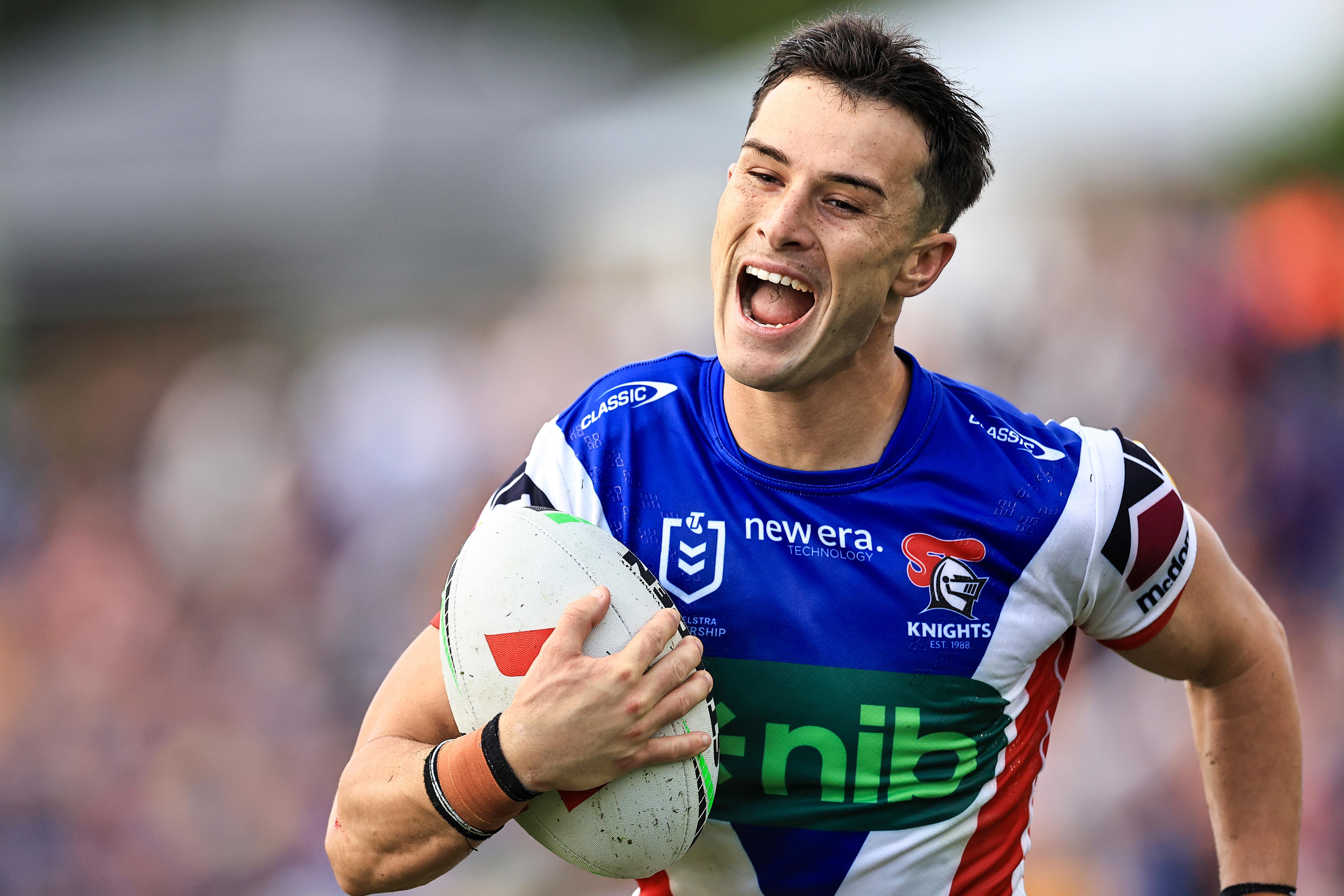 David Armstrong of the Knights smiles on his way to scoring a try during the round 10 NRL match between Wests Tigers and Newcastle Knights at Scully Park, on May 11, 2024, in Tamworth, Australia. (Photo by Mark Evans/Getty Images)