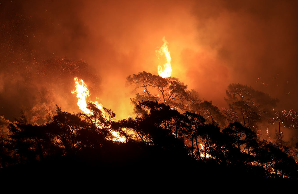 More than 100 wildfires have been brought under control in Turkey, according to officials but high temperatures are complicating the fight against five fires. (Photo by Mahmut Serdar Alakus/Anadolu Agency via Getty Images)